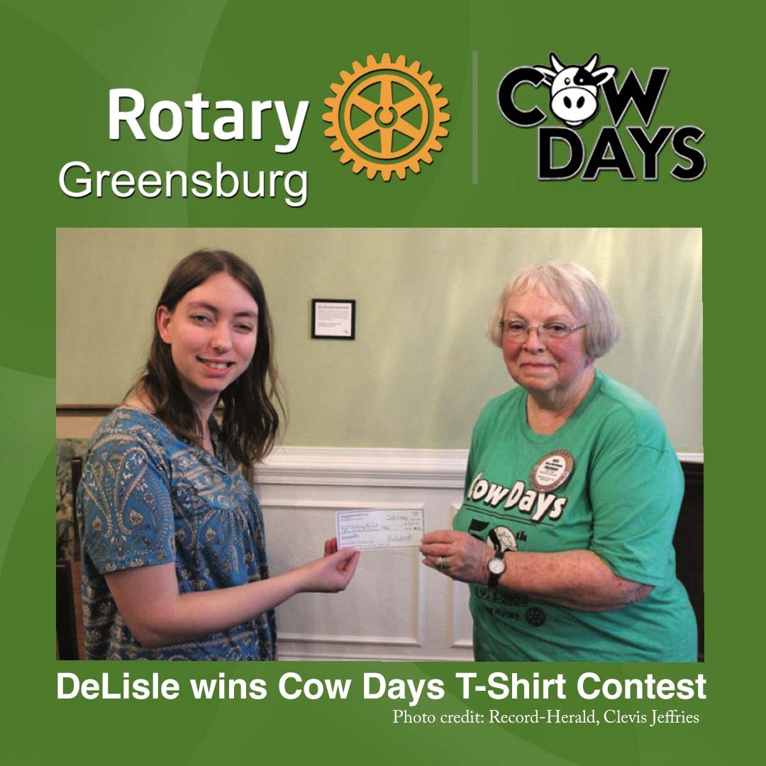 Meloney DeLisle, left, recently accepted a $300 check from Greensburg Rotary Club President Gaye McCubbin for winning the 2025 Cow Days T-shirt Design Contest.