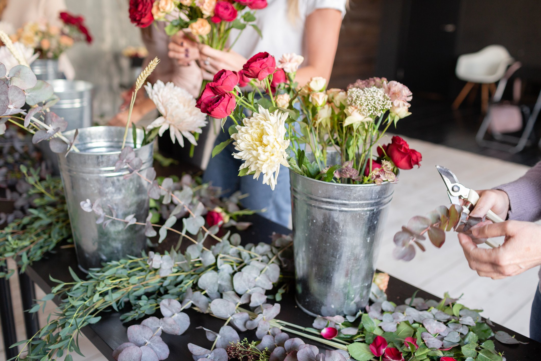 flower workshop with zinc buckets full of flowers