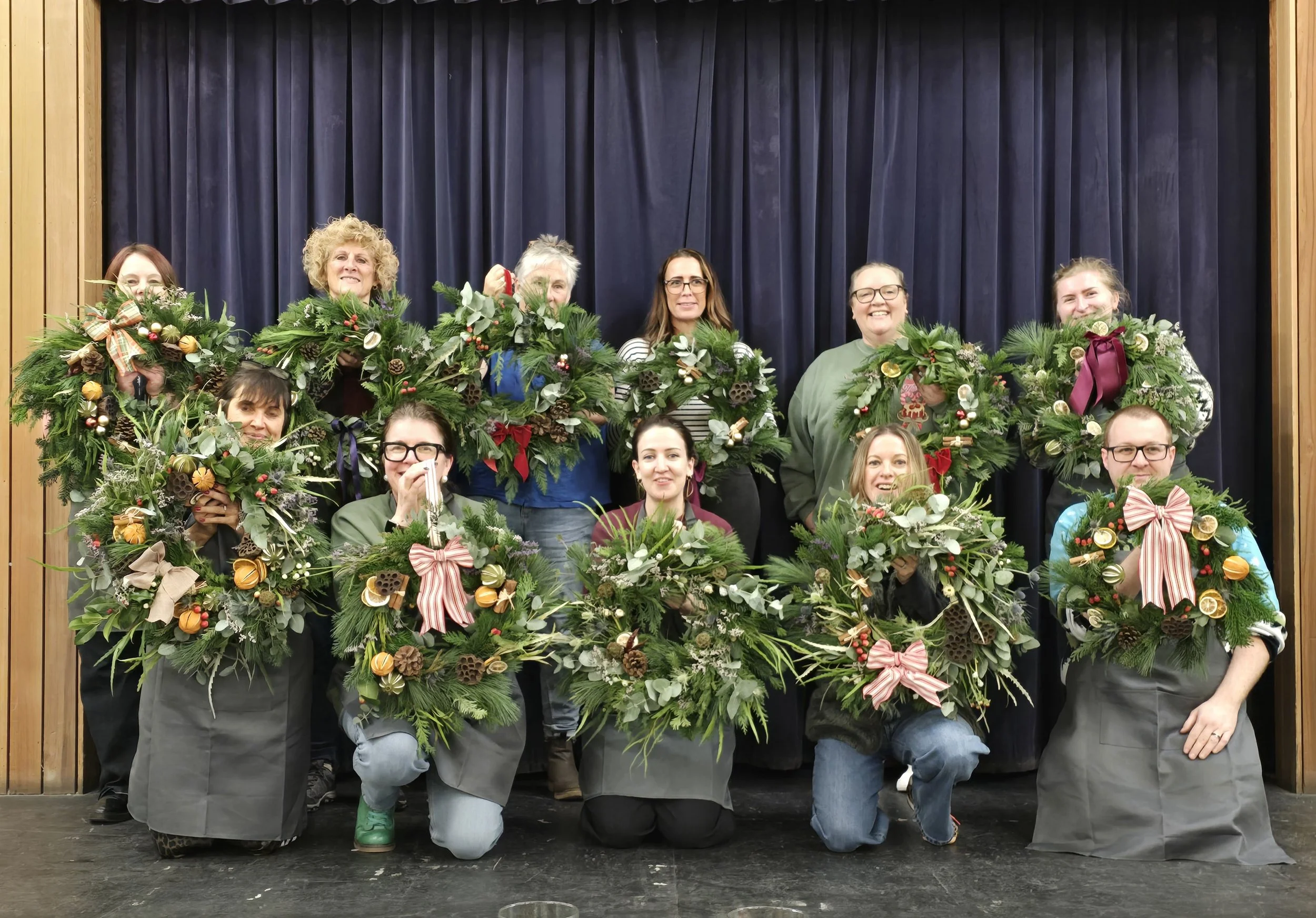 Christmas Wreath Workshop students with their finished wreaths (Copy) (Copy)