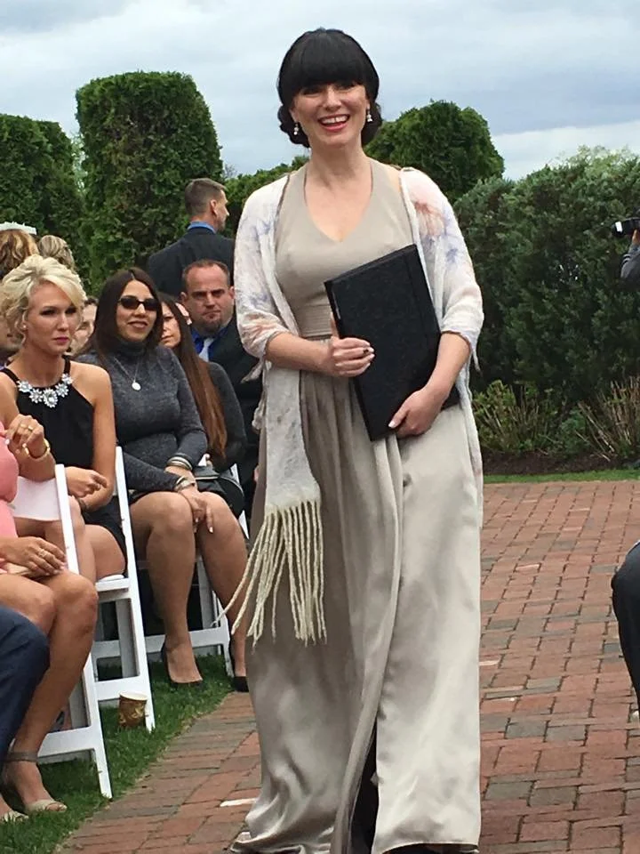Wilmington and Wrightsville Beach Wedding Officiant walking down aisle holding official folio