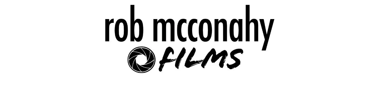 Logo of Rob McConahy Films with a camera shutter icon in black and white.