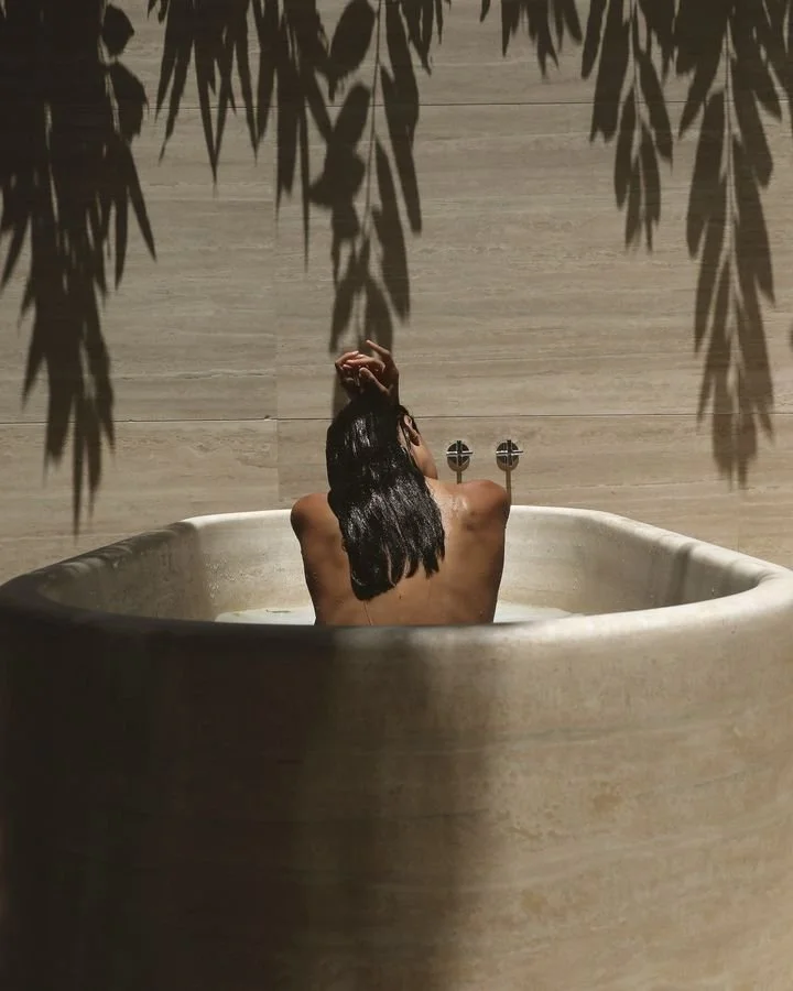 woman in spa bath at wellness hotel Nikki Martin wellness