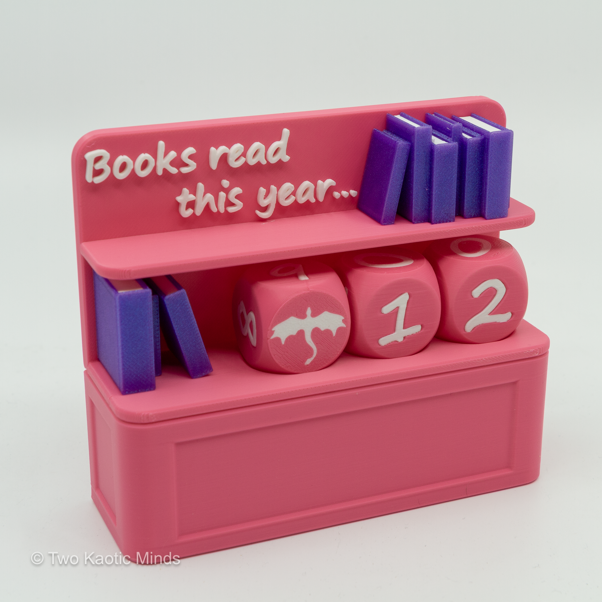 Pink 3D printed Book Counter reading tracker with purple mini books and dice, slightly different front angle