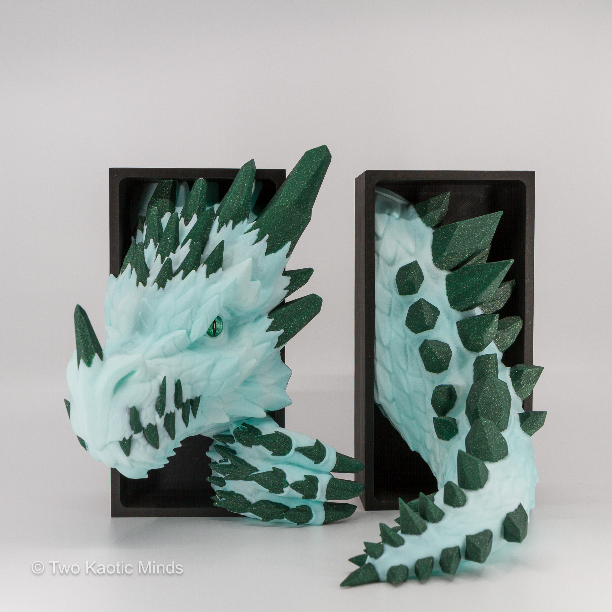 Close front angle of the green Crystal Dragon showing frost teal body, deep green sparkle crystal scale formations, and detailed face
