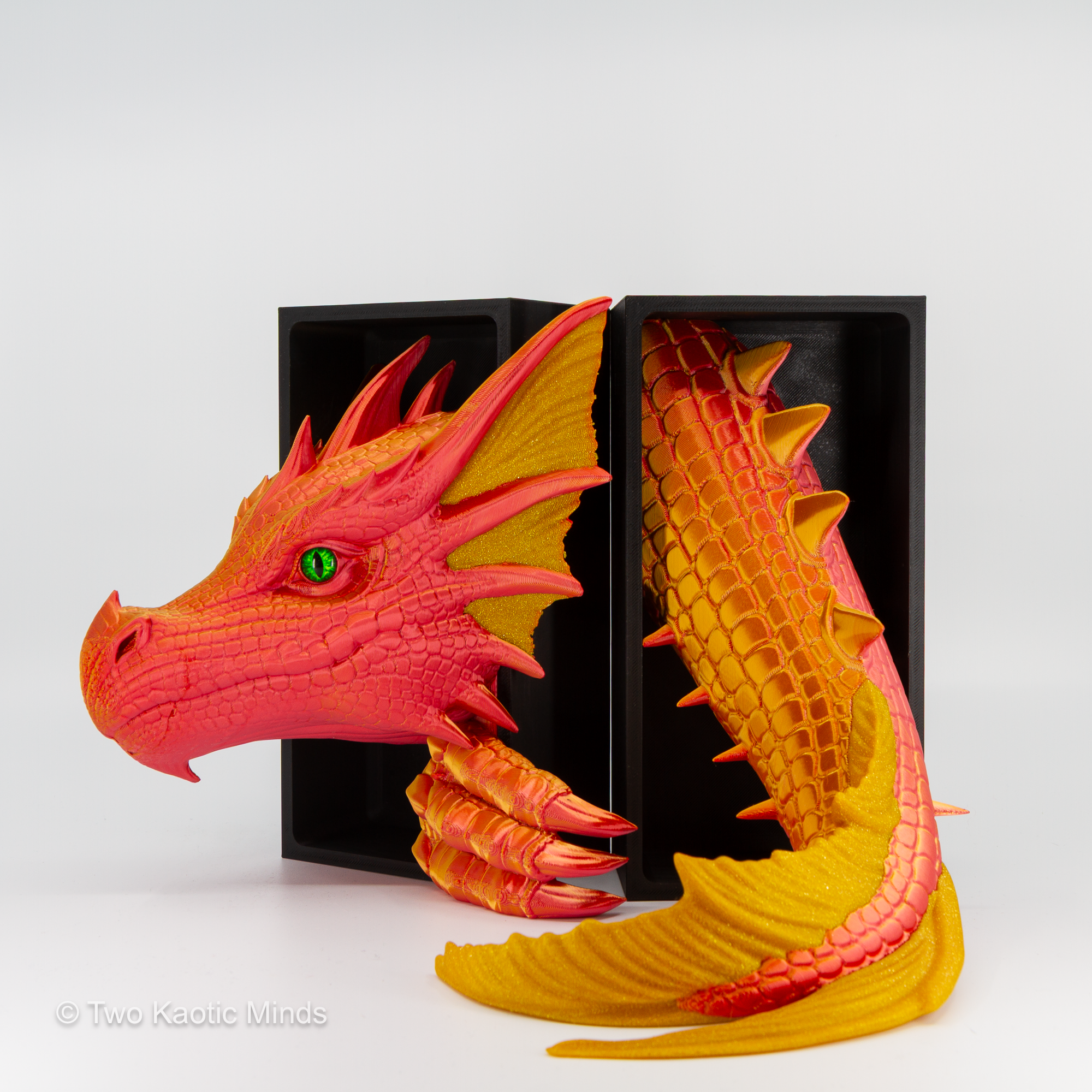 Sunset-Gold Sea Dragon head and tail set shown together with matte black outer box, angled view showing red-orange and gold two-tone detail