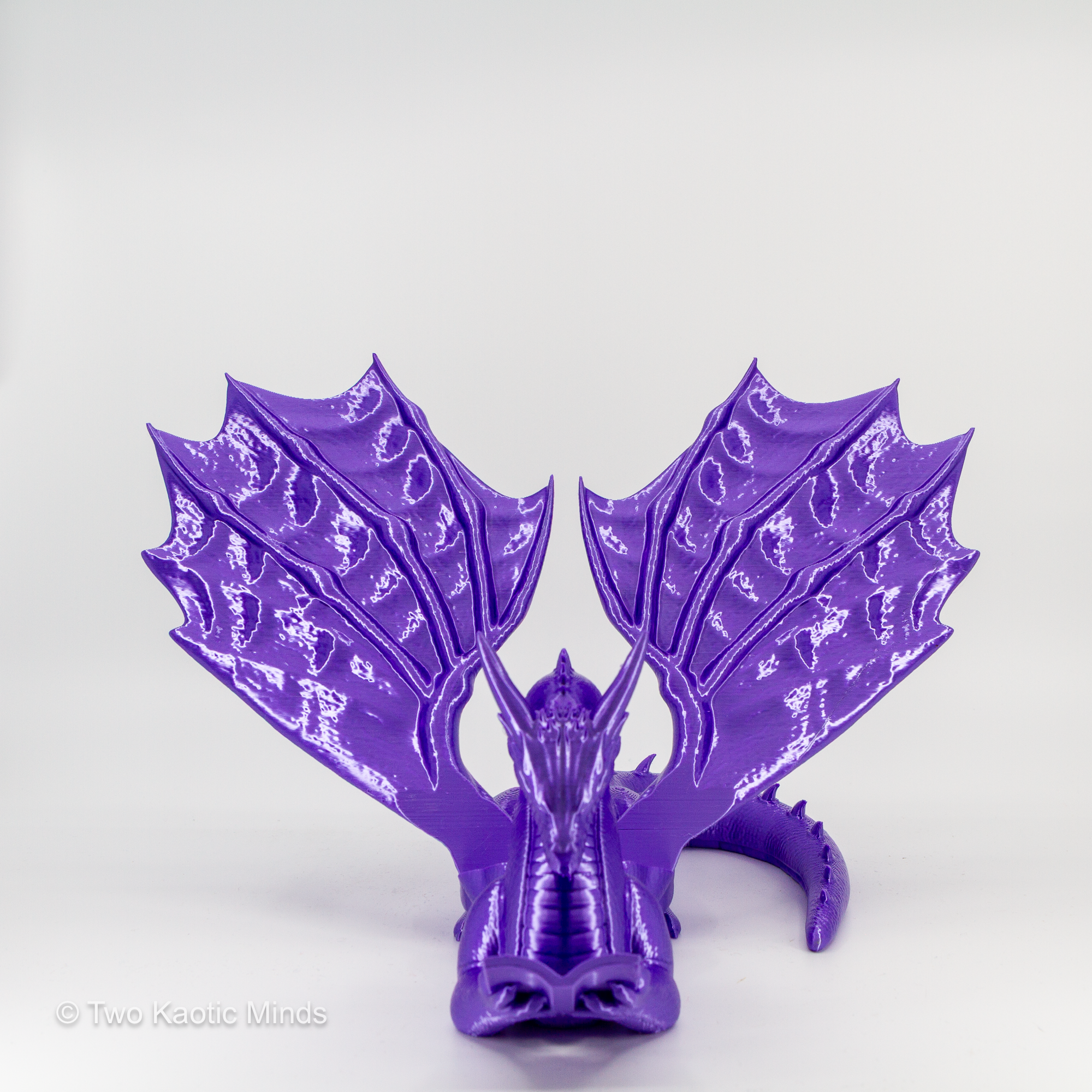 Purple dragon book holder angled left view showing wing detail and crouching dragon pose