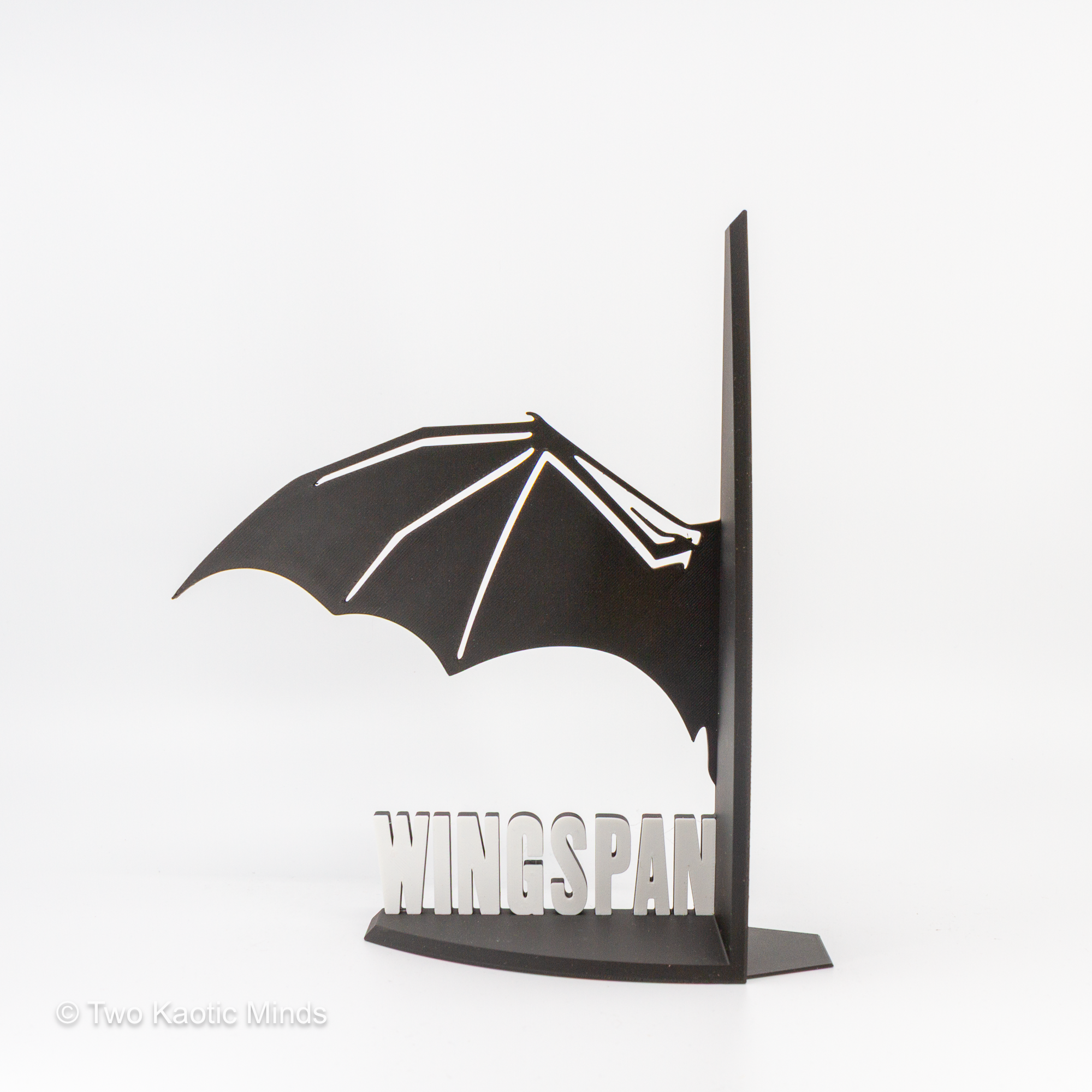 Single WINGSPAN dragon wing bookend in black and white shown from the front on white background
