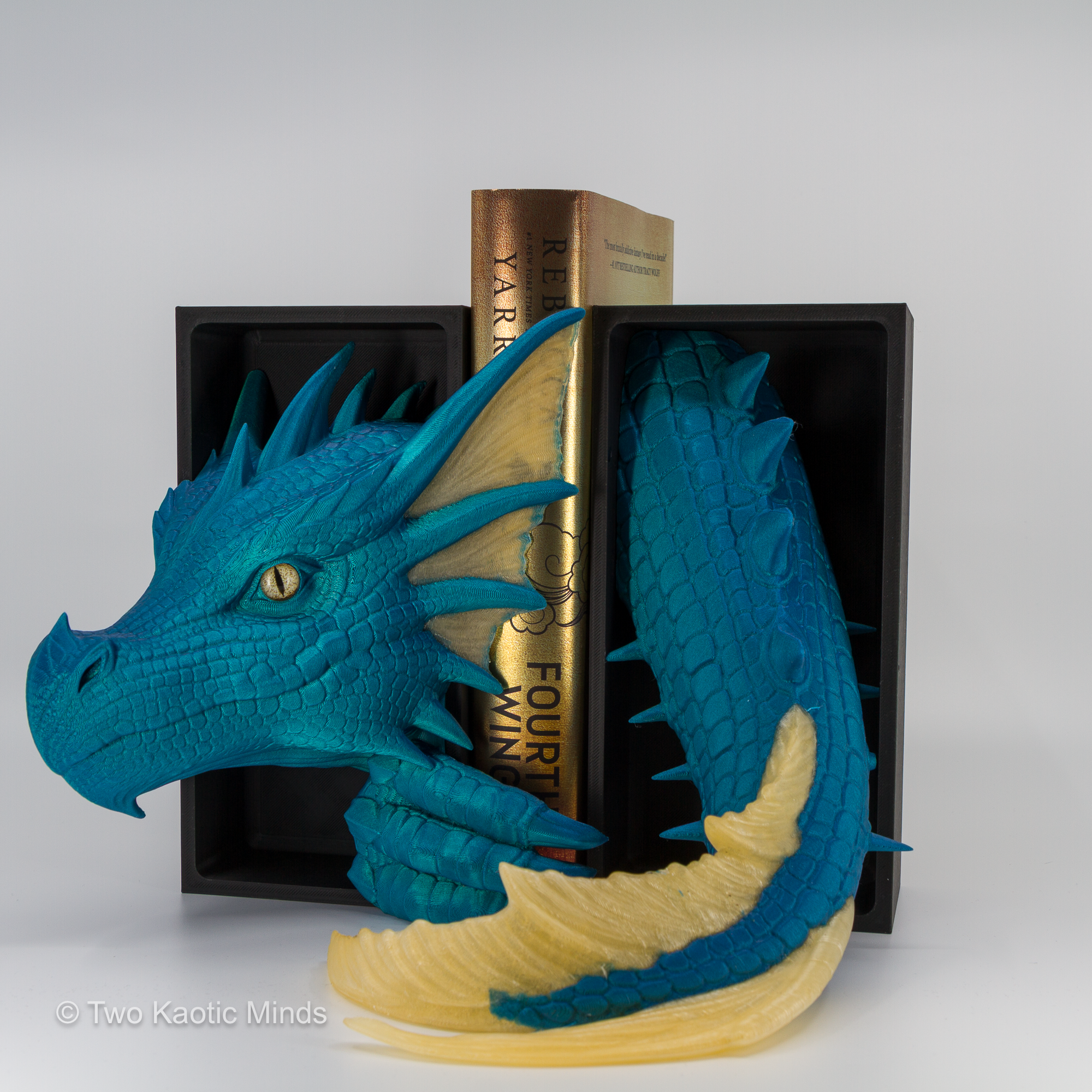 Close angle of the Neptune-Mellow Yellow Sea Dragon showing translucent mellow yellow fin accents and yellow glass eye against vivid teal body