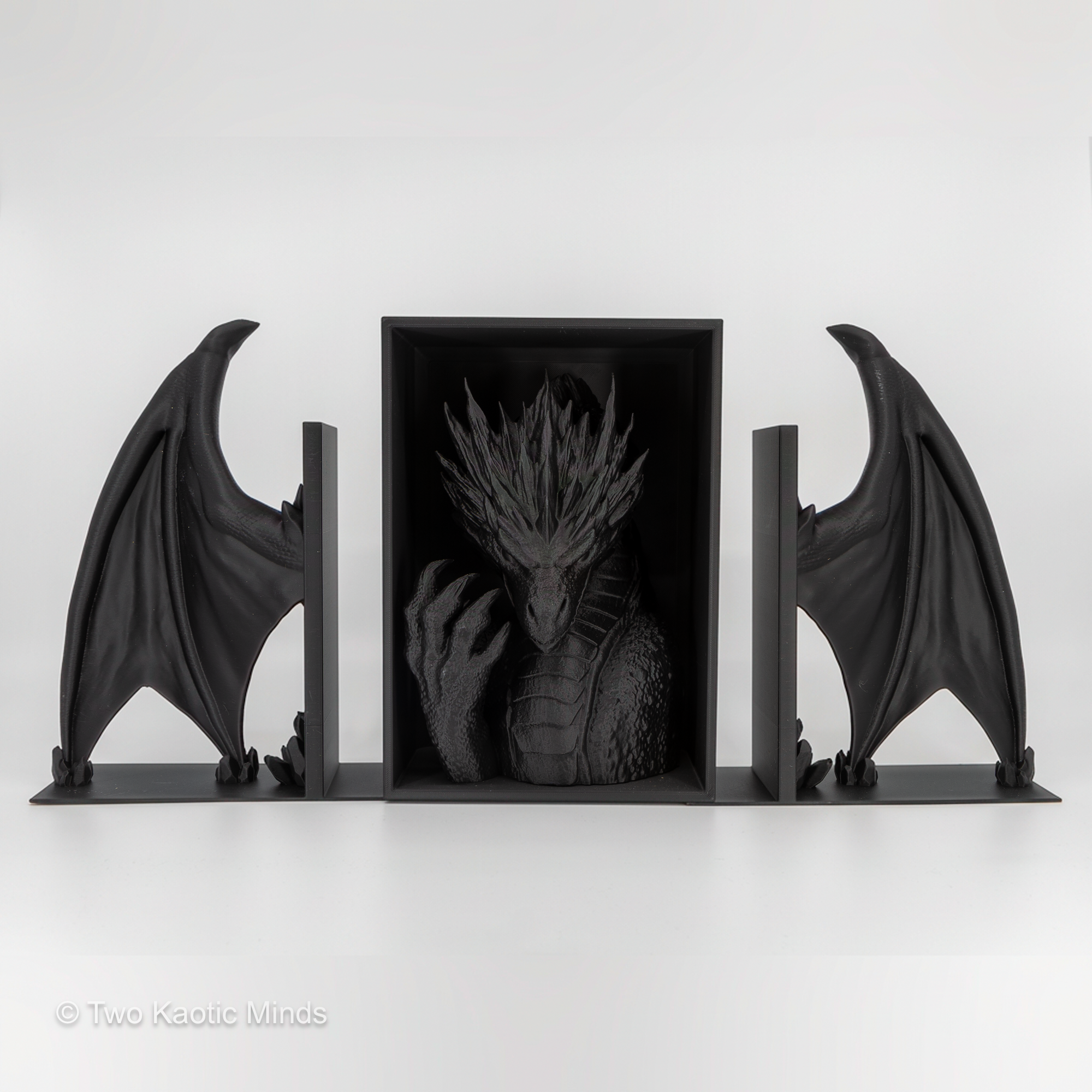 Complete Frost Dragon set showing head book nook flanked by both wing bookends without books, full front view of the three-piece matte black display