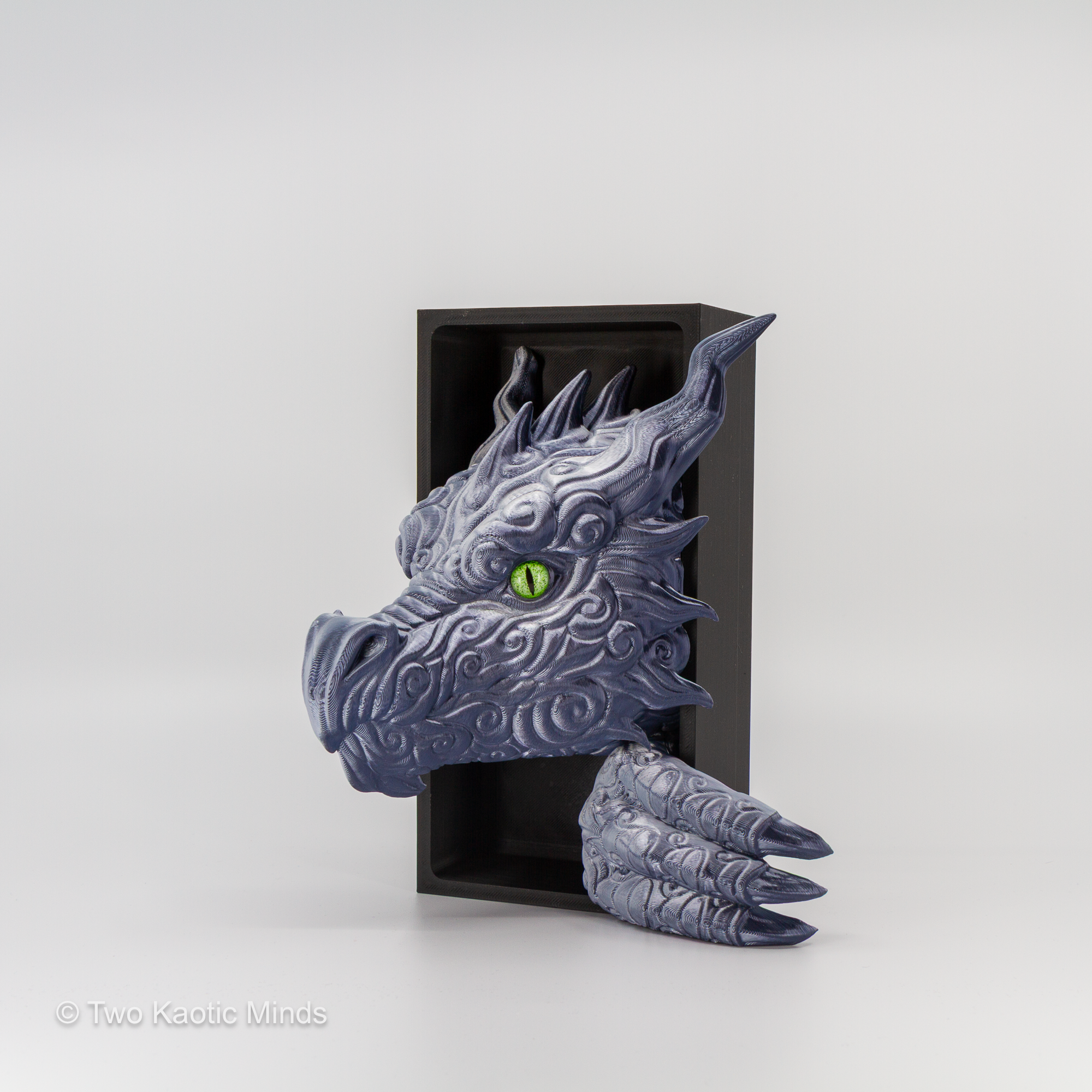 3D printed granite blue-grey Cloud Dragon book nook showing detailed dragon head with green eyes emerging from a matte black box, front angle view on grey background