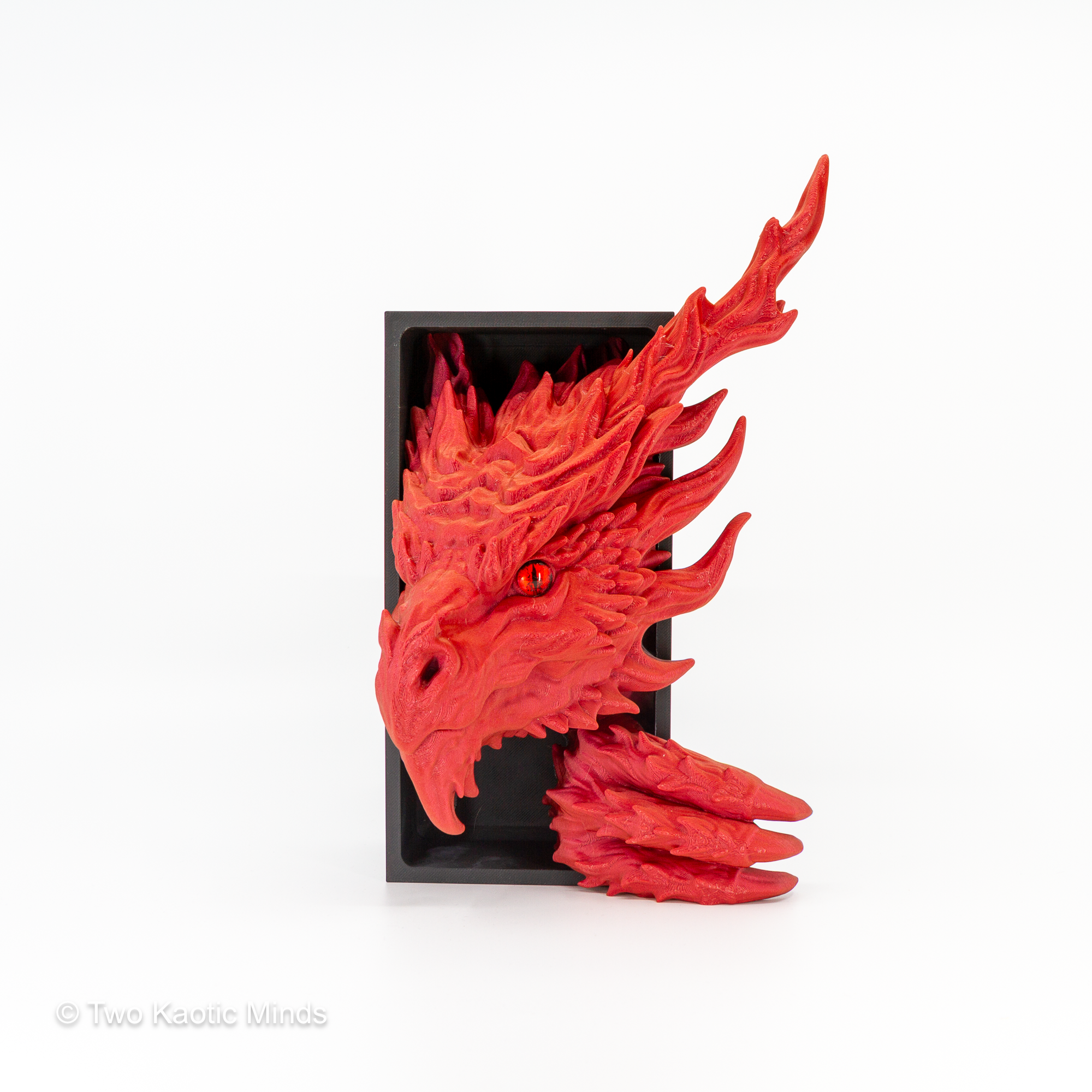 Angled front view of the red Inferno Dragon book nook showing fierce dragon expression, sweeping horns, and flame-textured scale detail