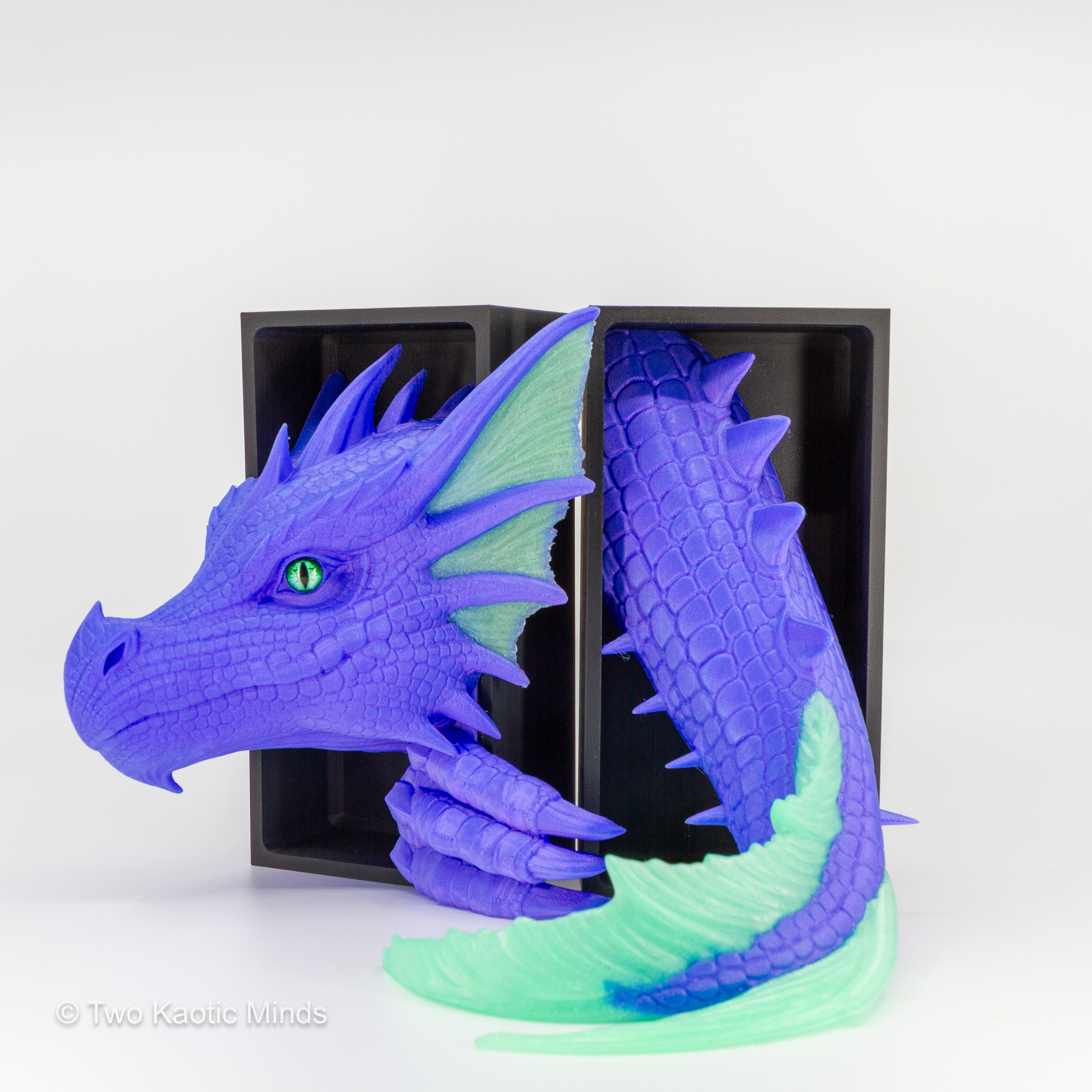 Pulsar-Jade Sea Dragon head and tail set shown together with matte black outer box, angled view showing purple and translucent jade green two-tone detail