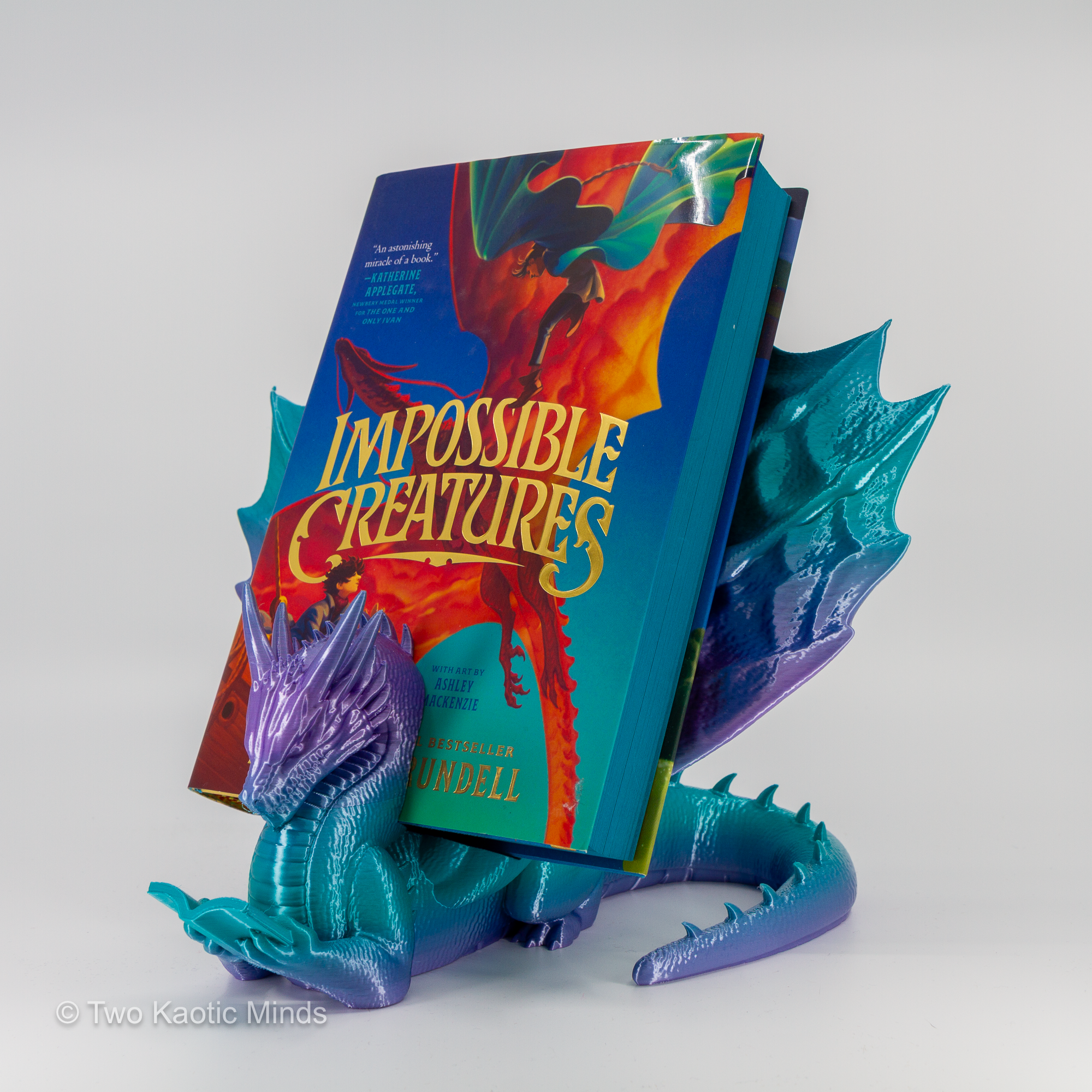 Mermaid gradient dragon book holder in use with Impossible Creatures book standing in the slot