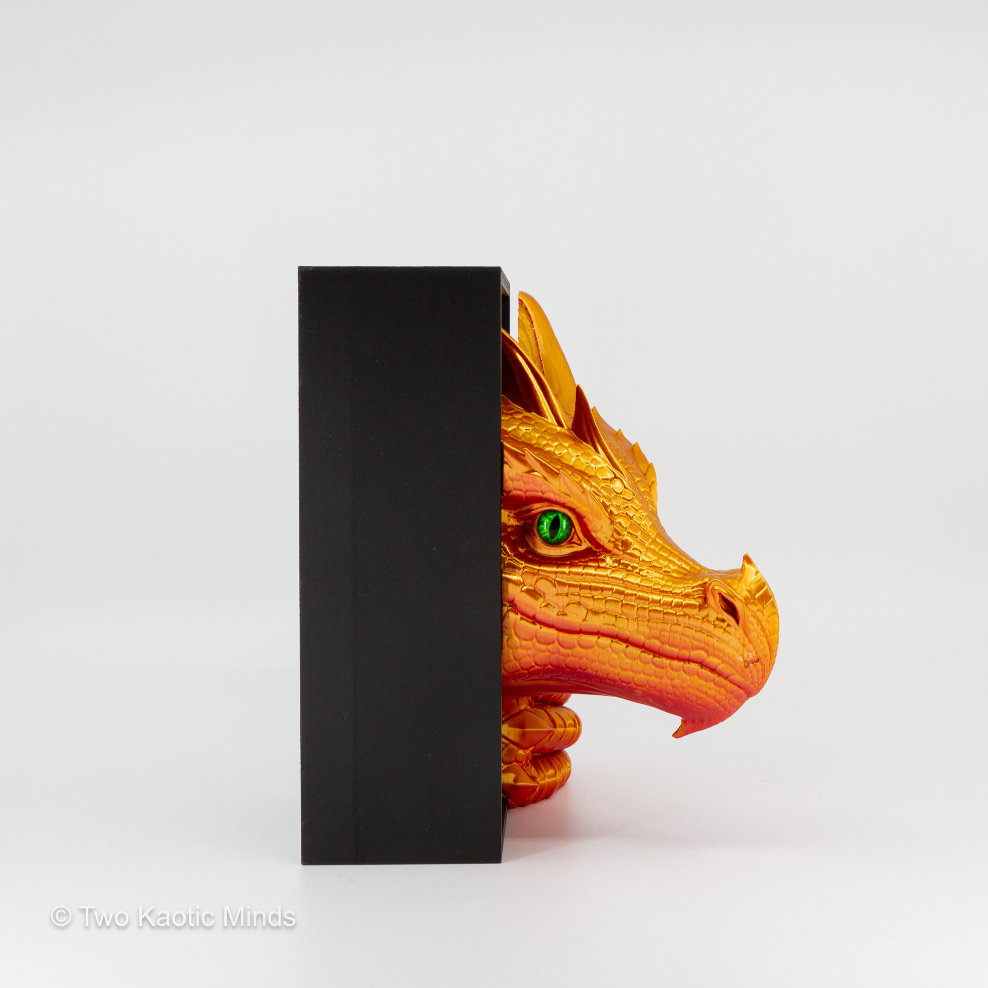 Side view of the Sunset-Gold Sea Dragon book nook showing dragon head profile against the matte black outer box
