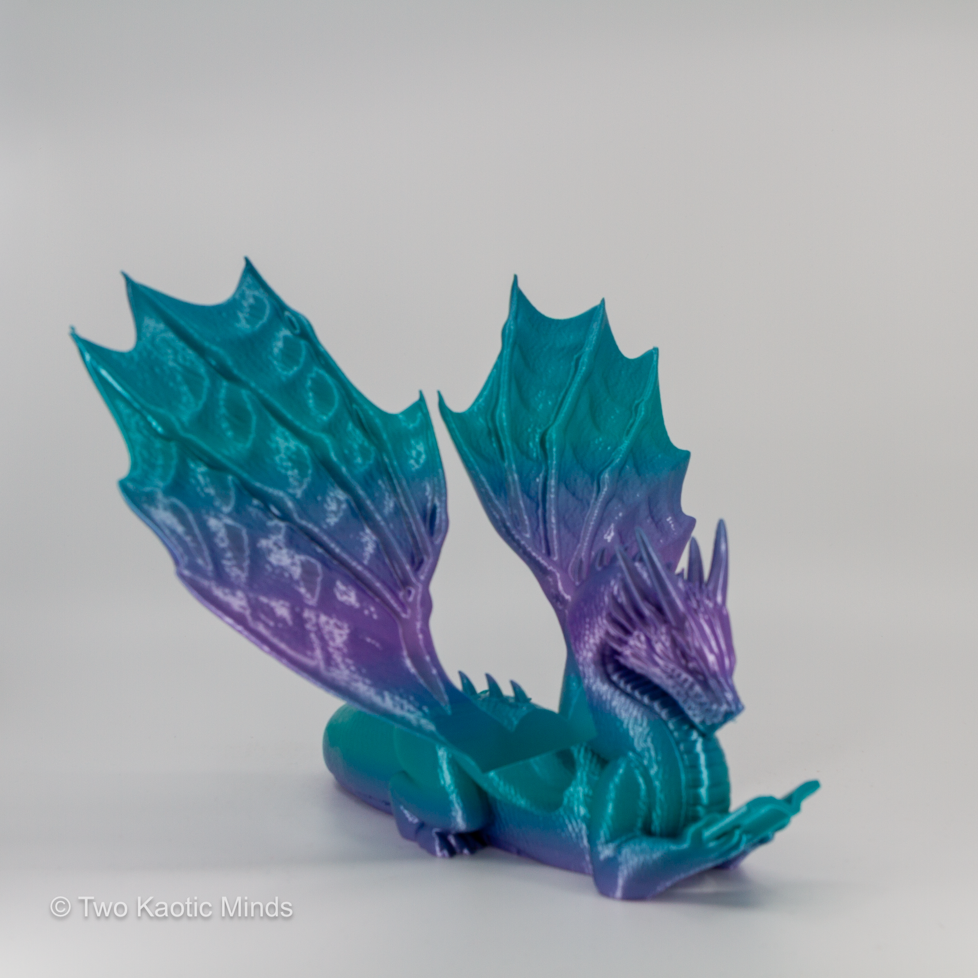 3D printed mermaid gradient dragon book holder transitioning from teal to purple, front view on grey background