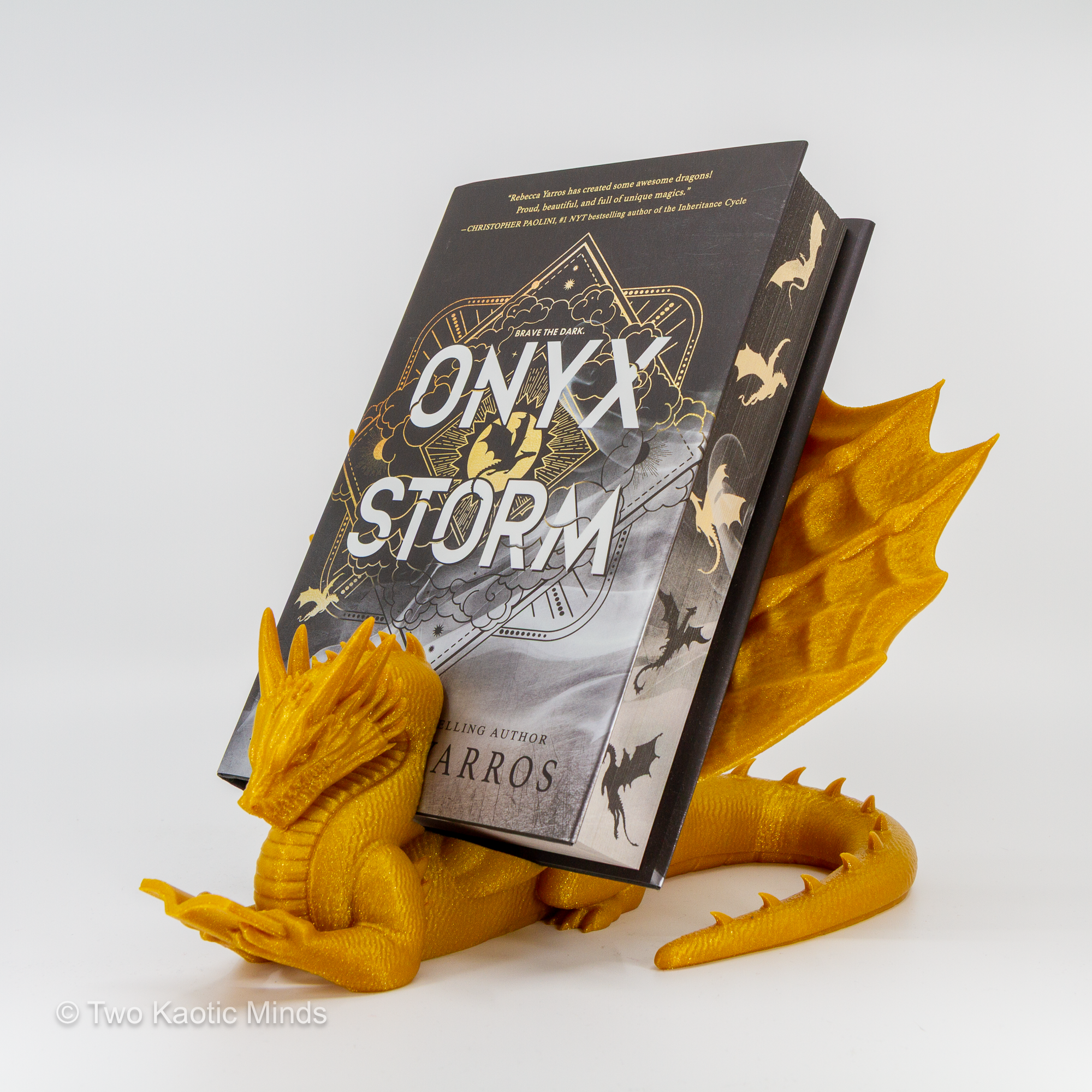 Gold dragon book holder in use with Onyx Storm book standing upright in the slot