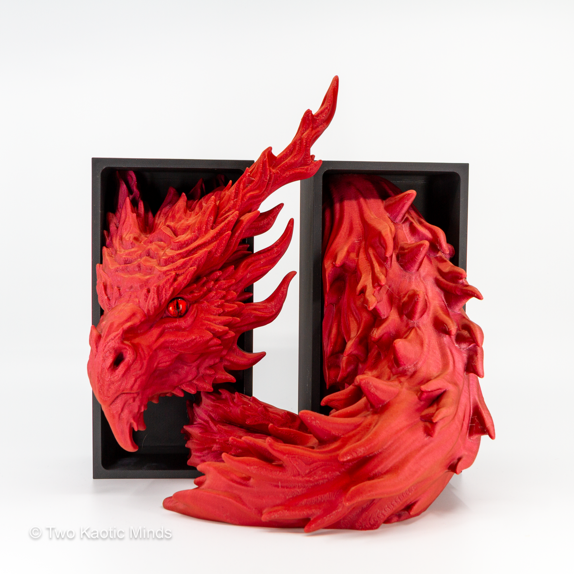 Close front angle of the Inferno Dragon showing flame-swept scale texture, dramatic horns, and fierce dragon face detail in sparkle red