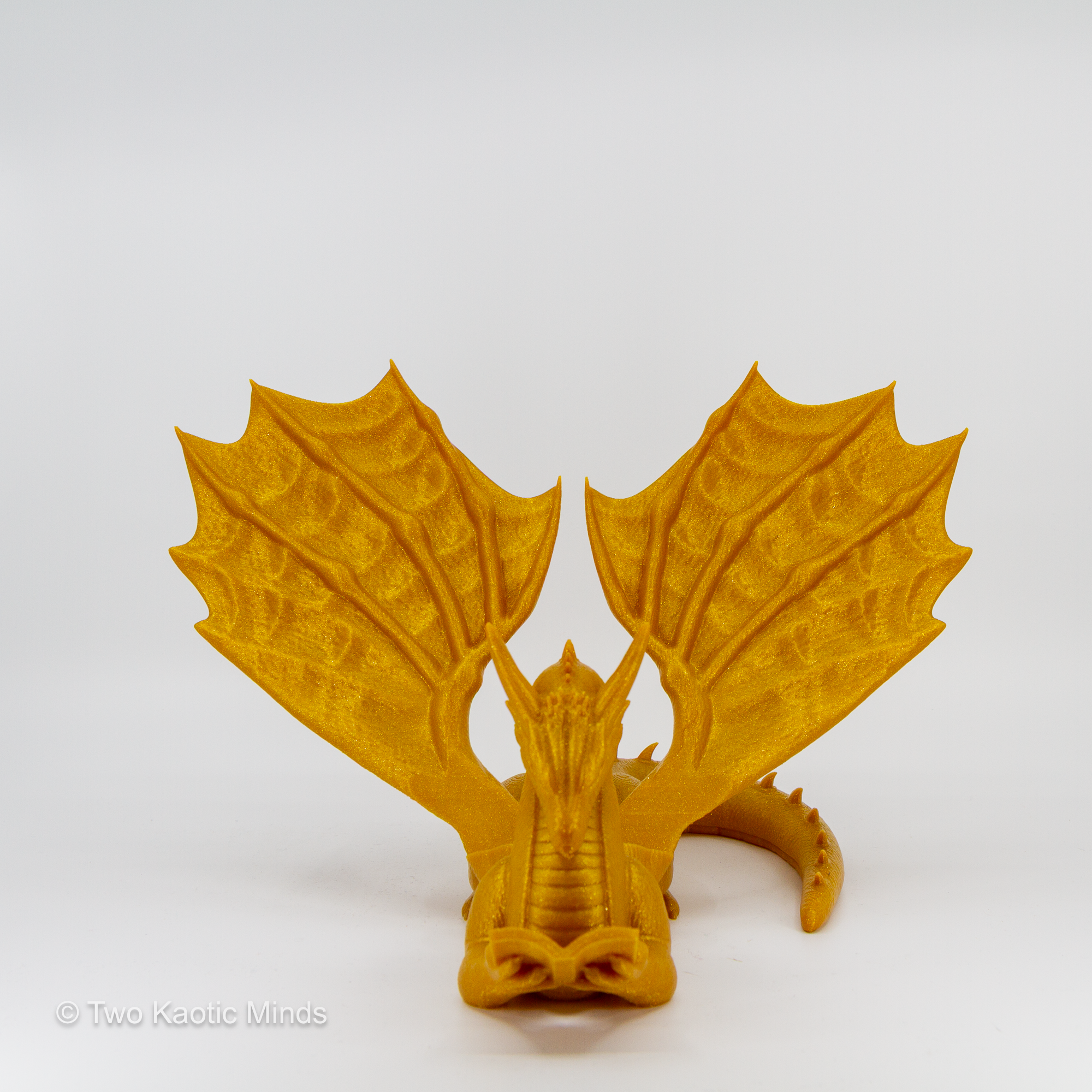 Gold dragon book holder angled left view showing rich golden color and wing detail