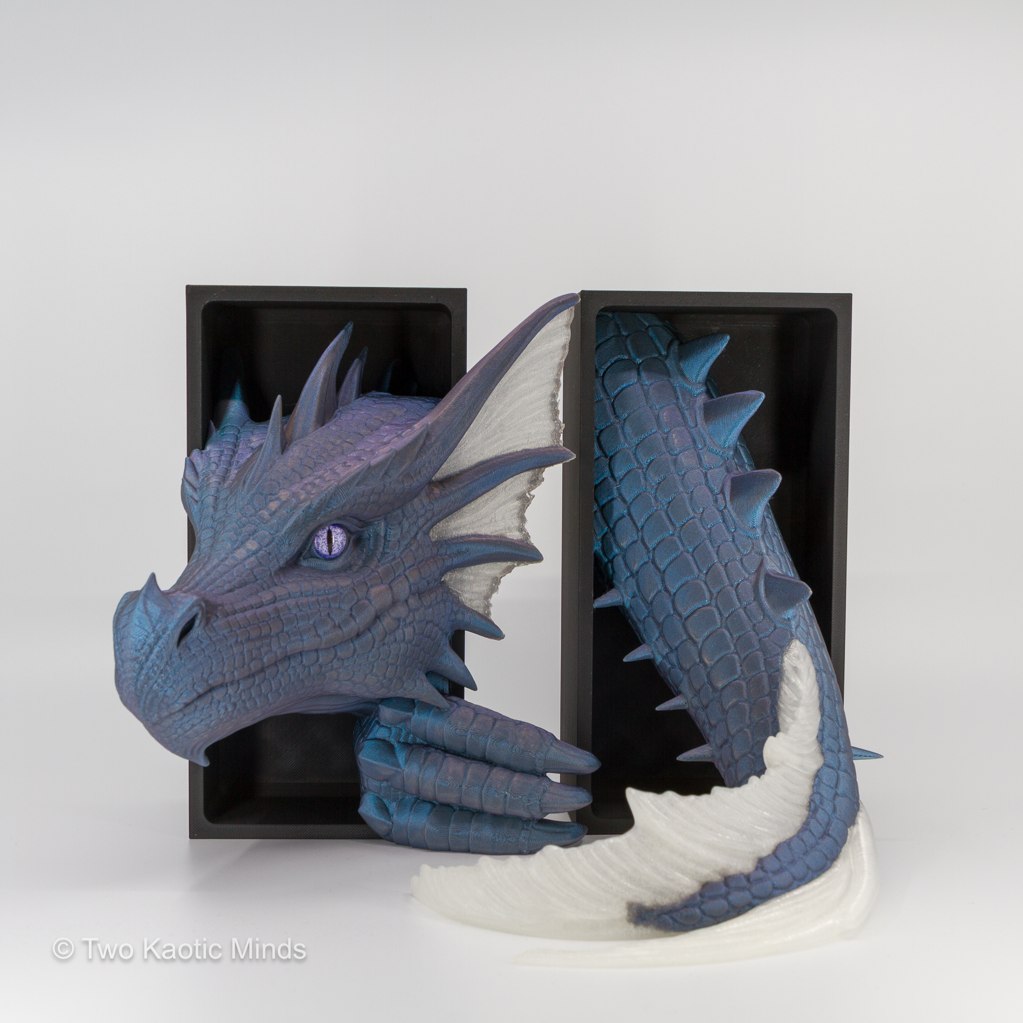 Mercury-Natural Sea Dragon book nook in use with a book between the head and tail, showing translucent natural white accents