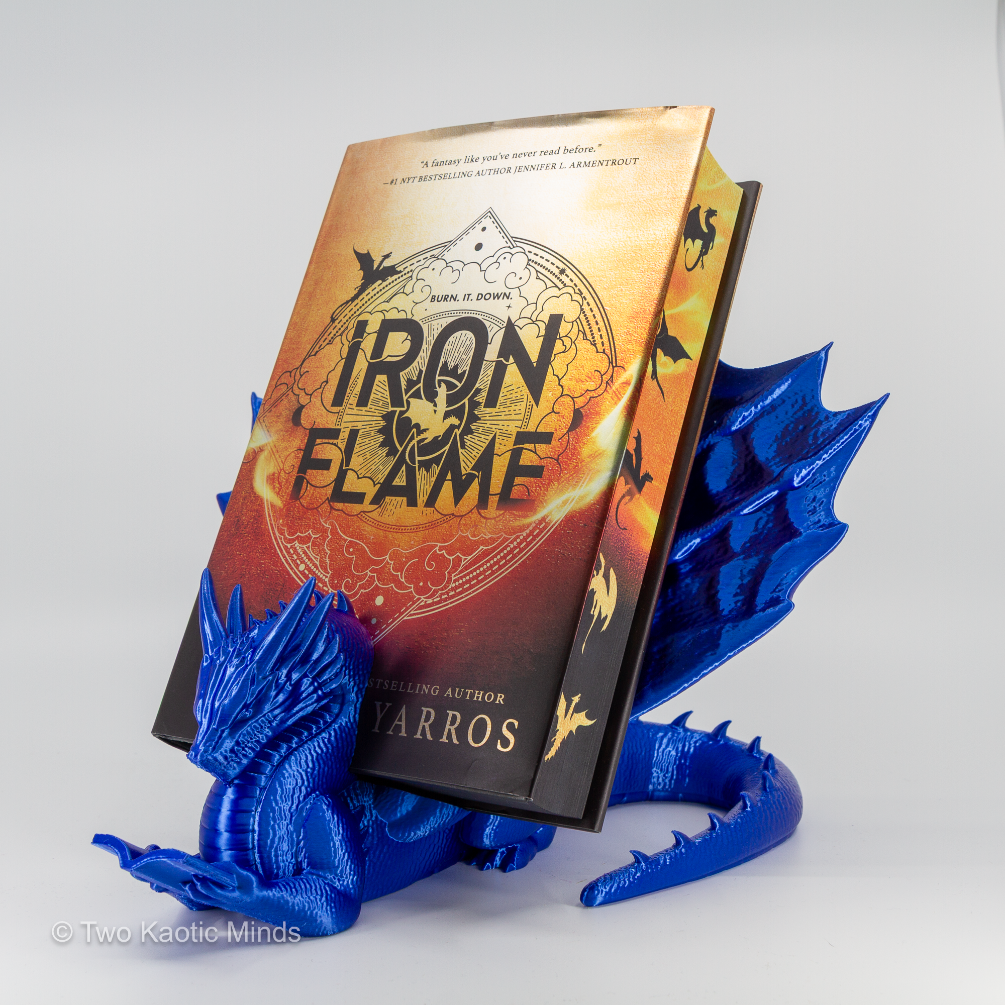 Blue dragon book holder in use with Iron Flame book standing upright in the slot