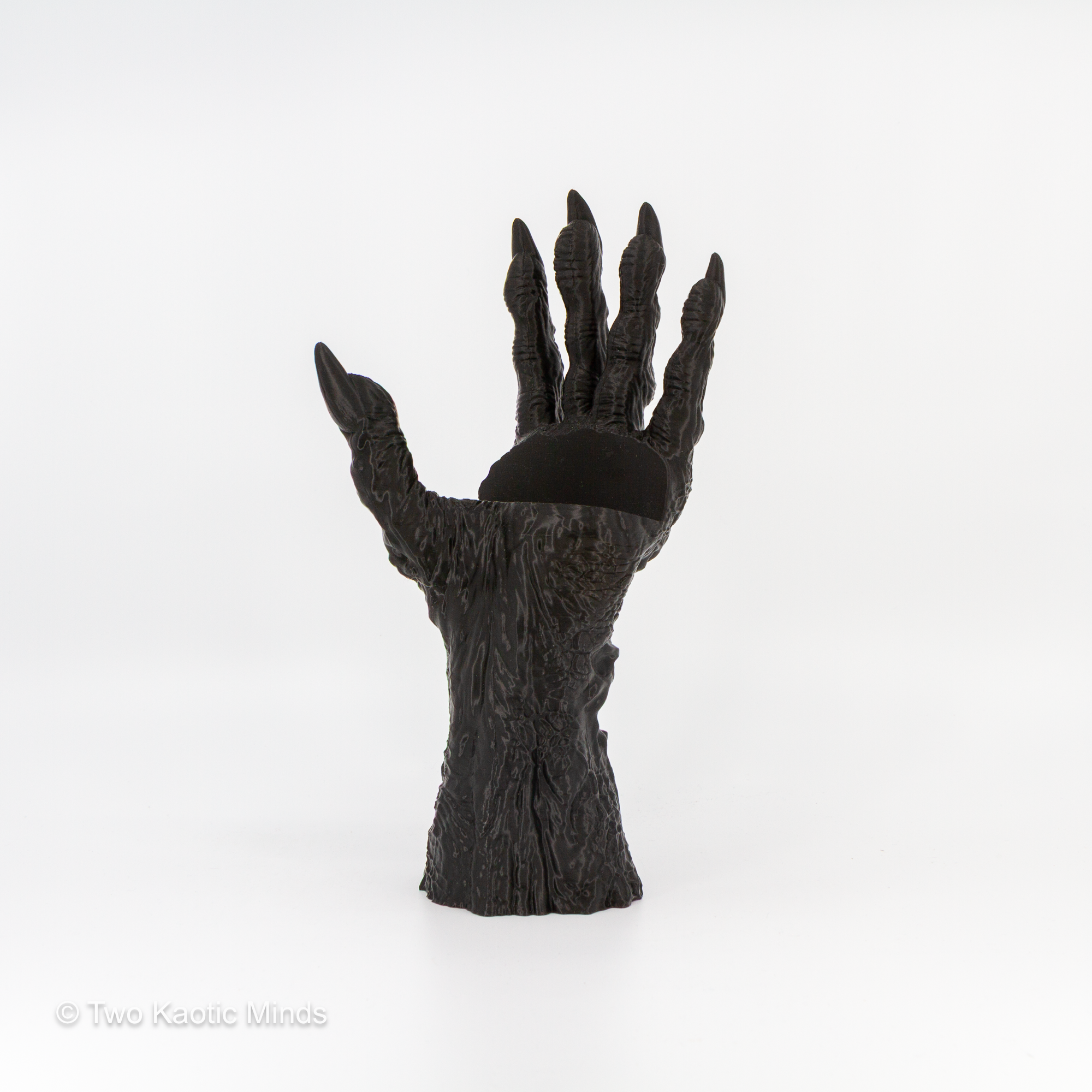 Rear angle view of the Death's Grasp clawed hand book holder showing textured back surface and wrist base
