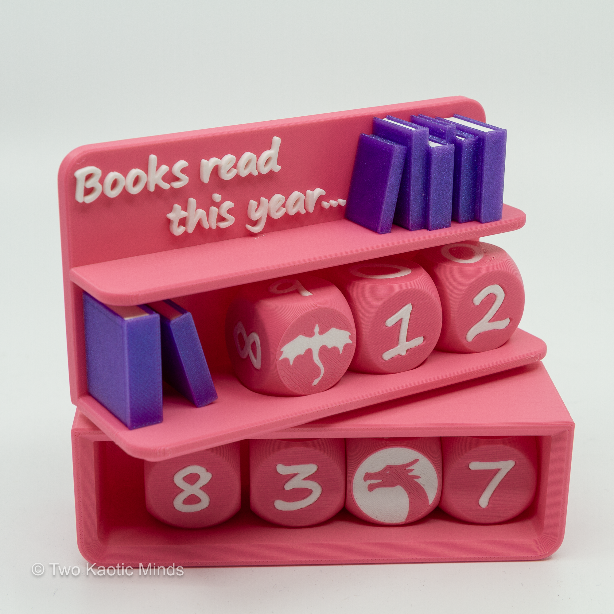 Pink Book Counter with dice arranged in front showing numbers 8, 3, and 7