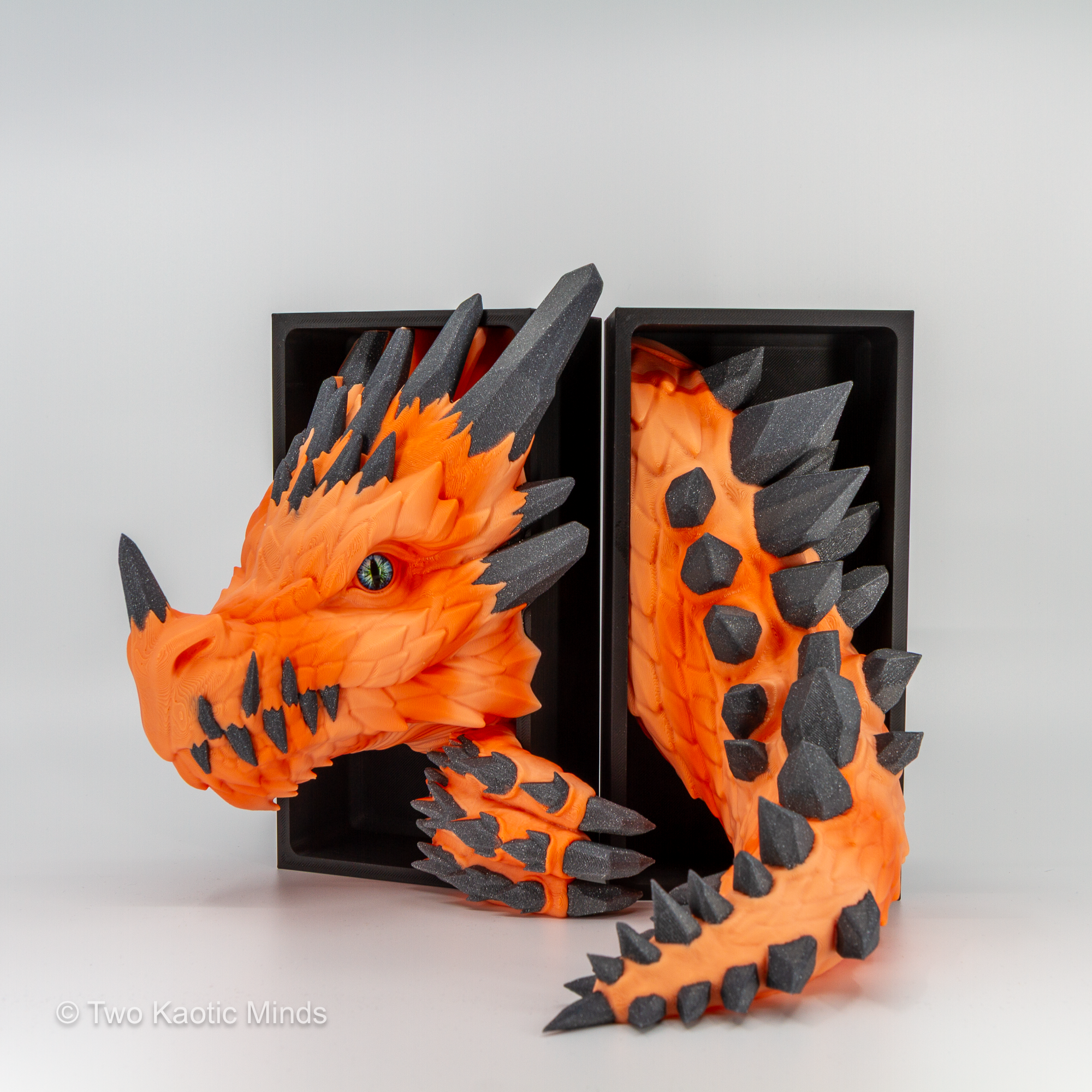 Orange Crystal Dragon head and tail set shown together with matte black outer box, angled view showing the full sunrise and grey sparkle two-tone detail