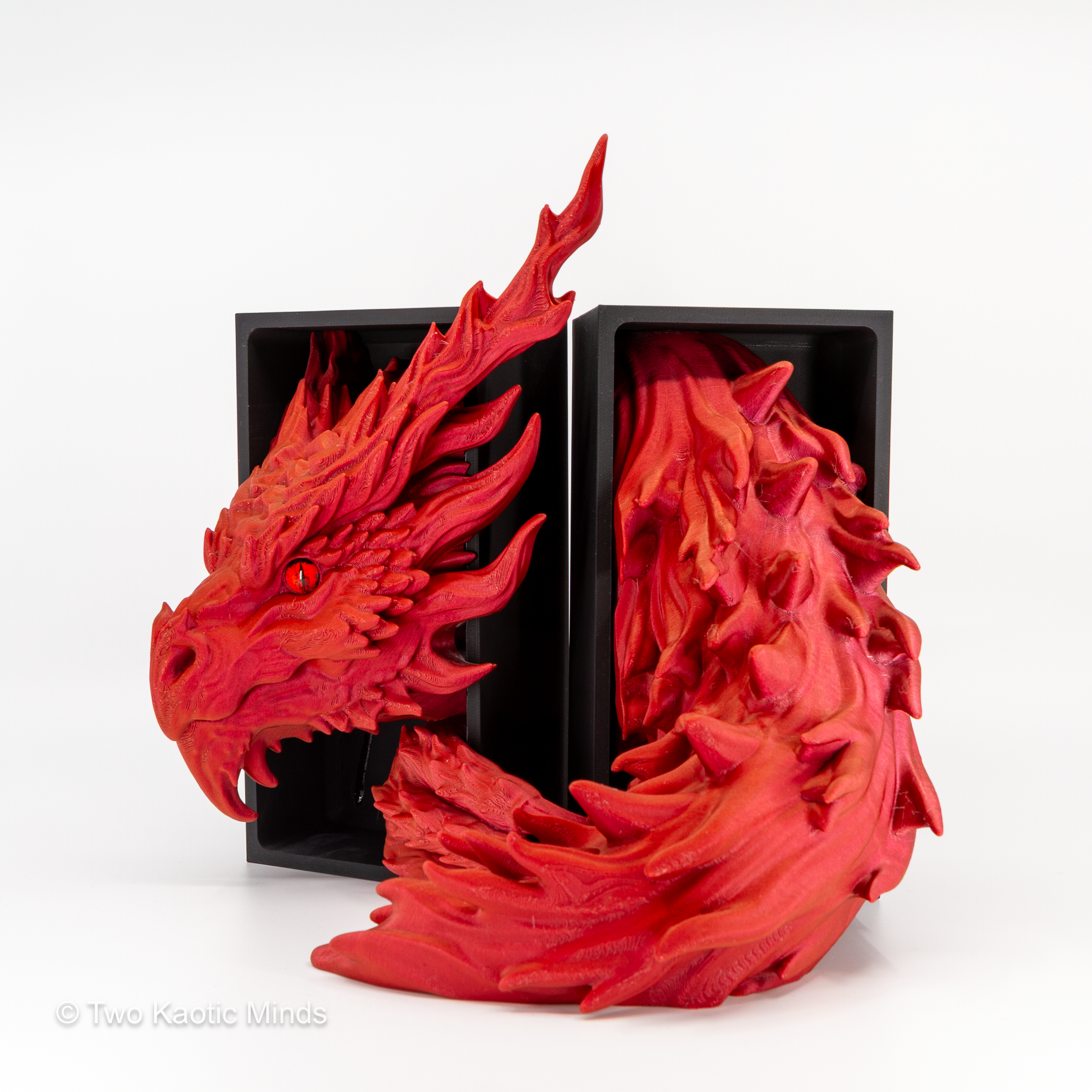 Inferno Dragon head and tail set shown together with matte black outer box, angled view showing full sparkle red dragon detail