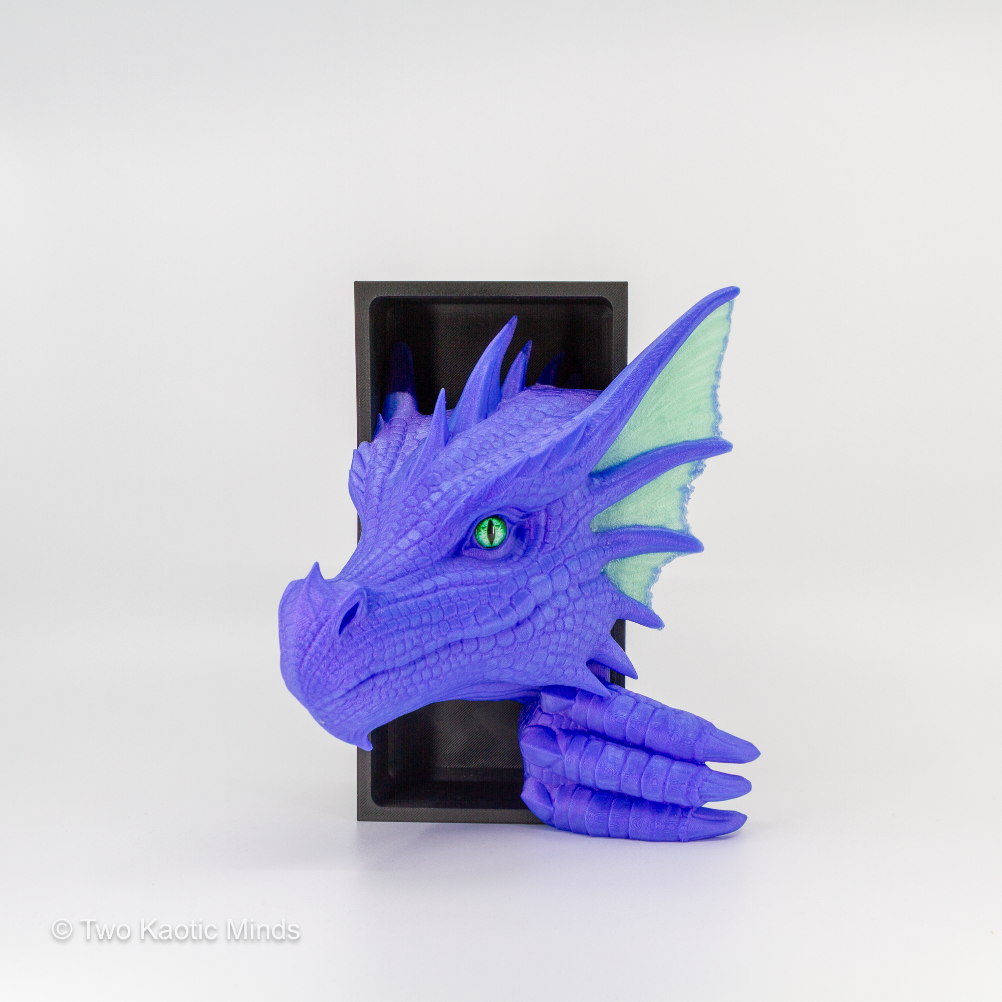 Angled front view of the Pulsar-Jade Sea Dragon showing vibrant purple body and translucent jade green fin detail with green glass eye