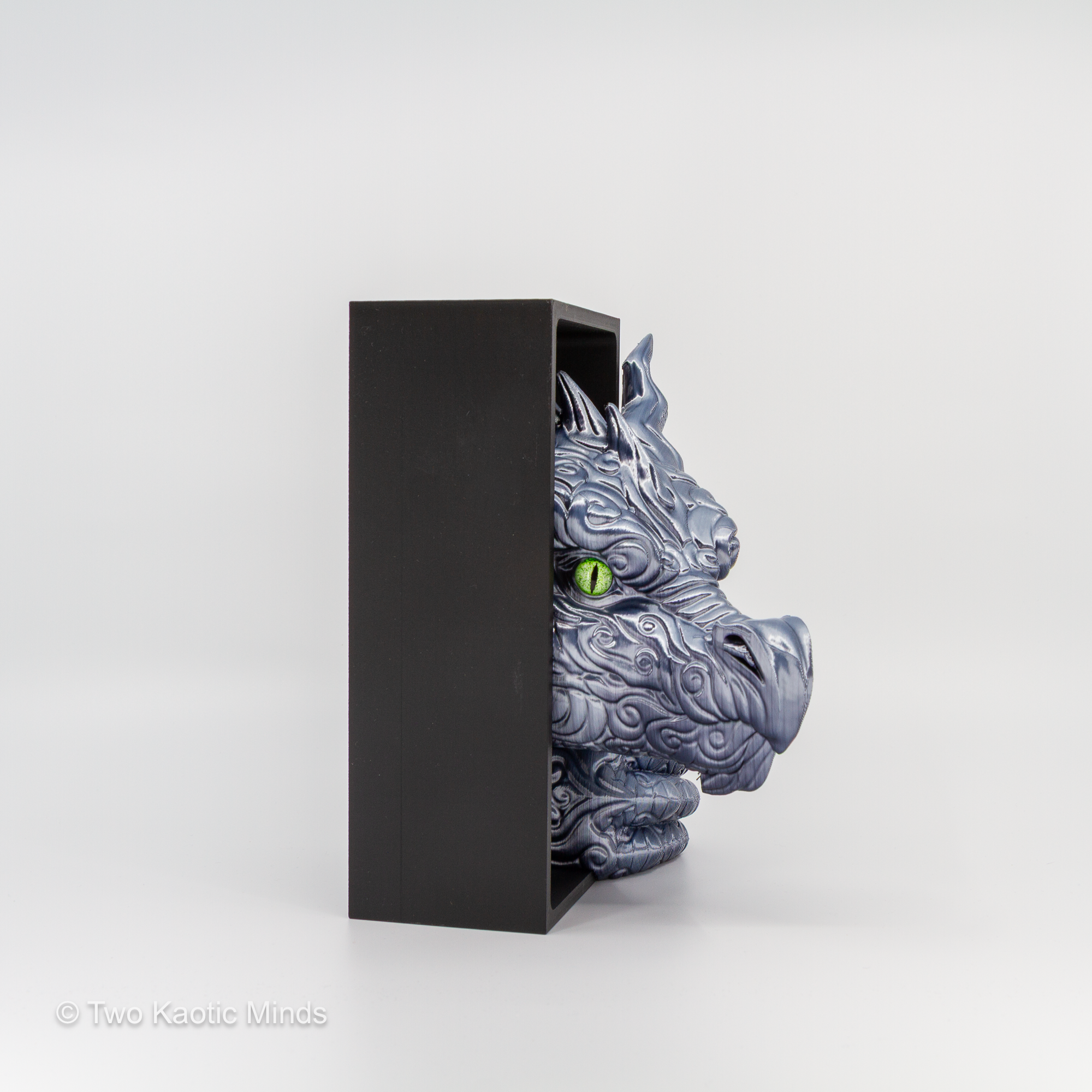 Side view of the granite Cloud Dragon book nook showing the dragon head profile with matte black outer box