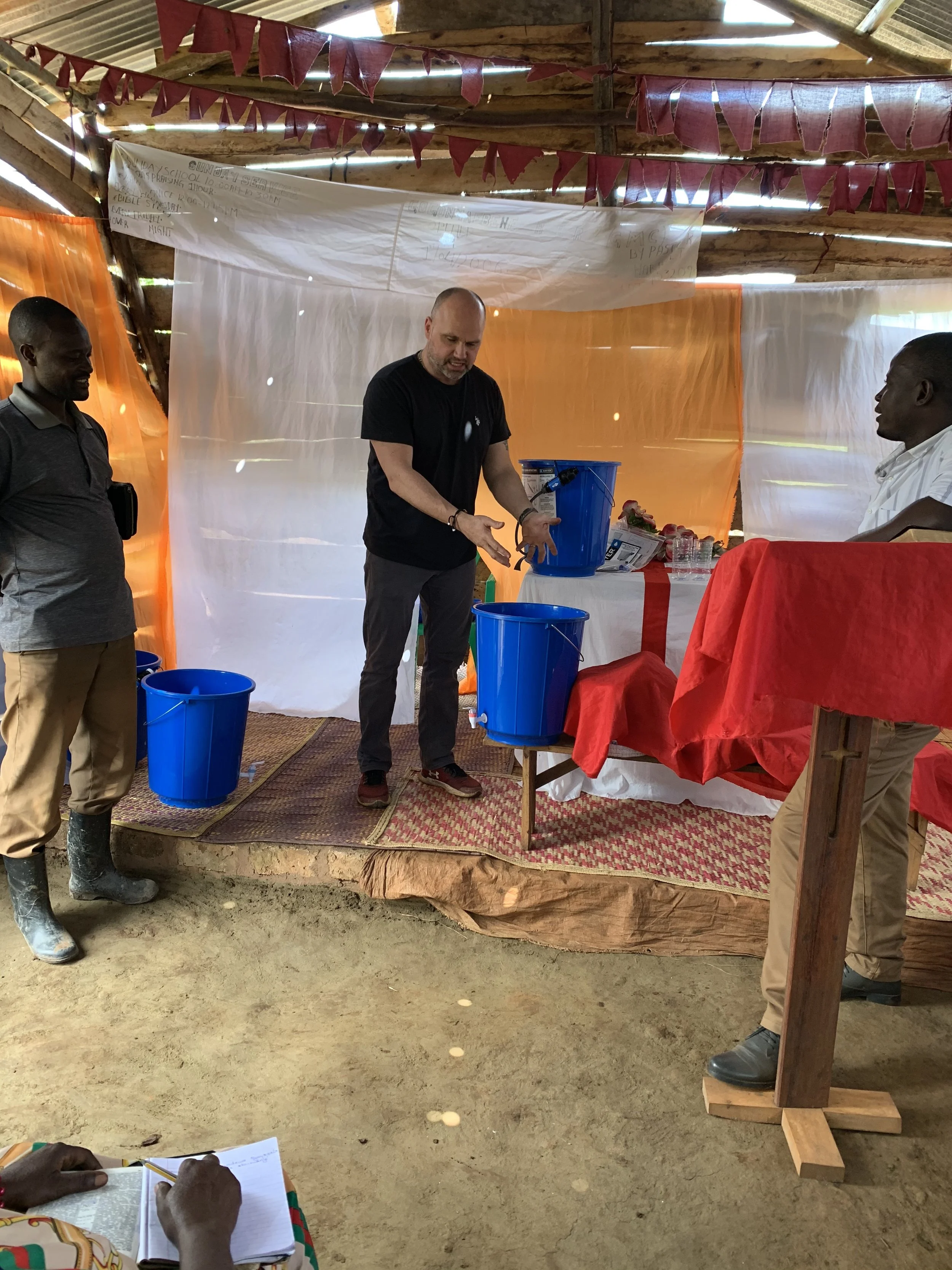 Giving a lesson on the water filter