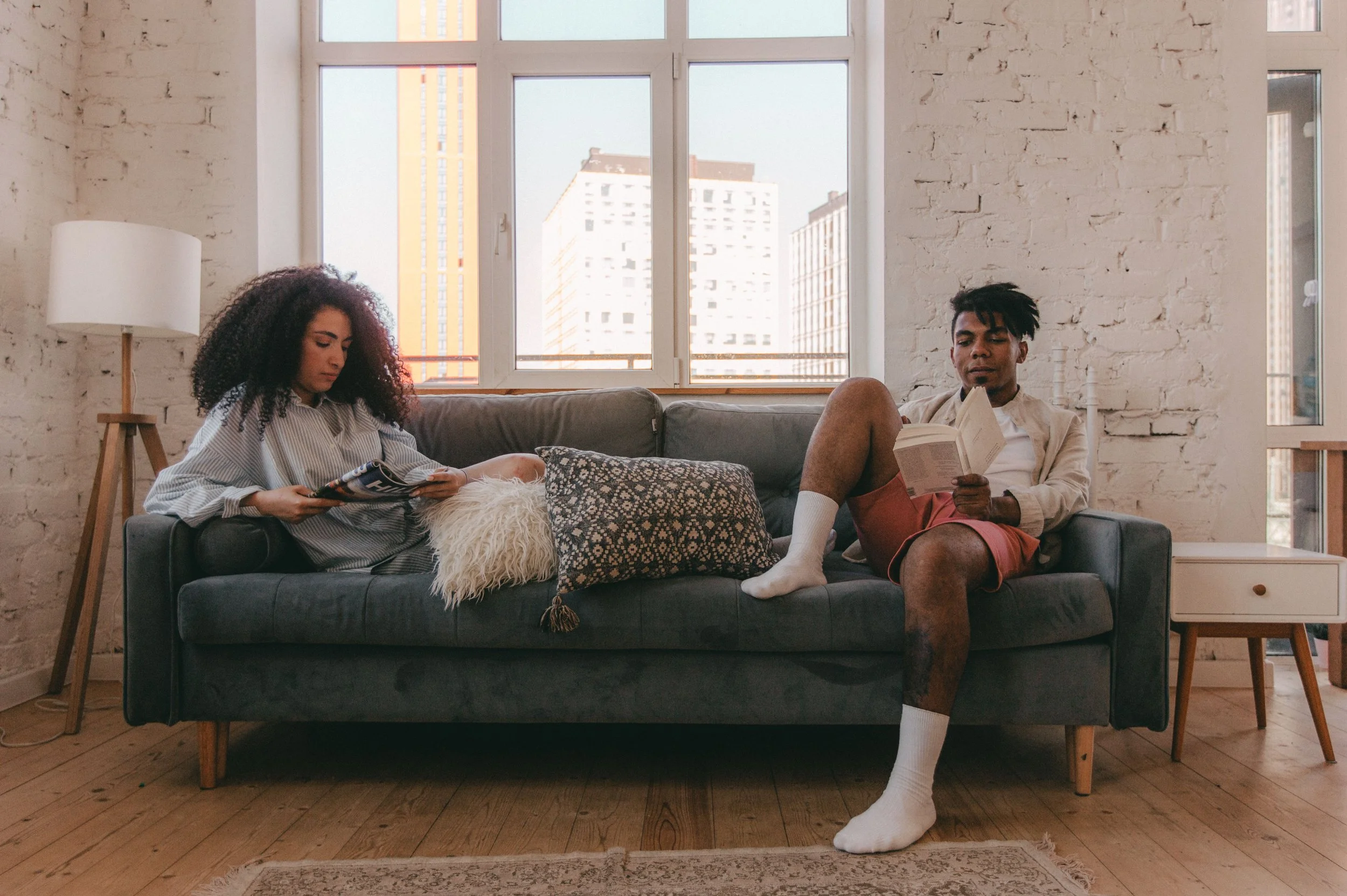 A couple moving through their home without connecting, representing the roommate phase that couples therapy in Florida at Collected Connections helps address