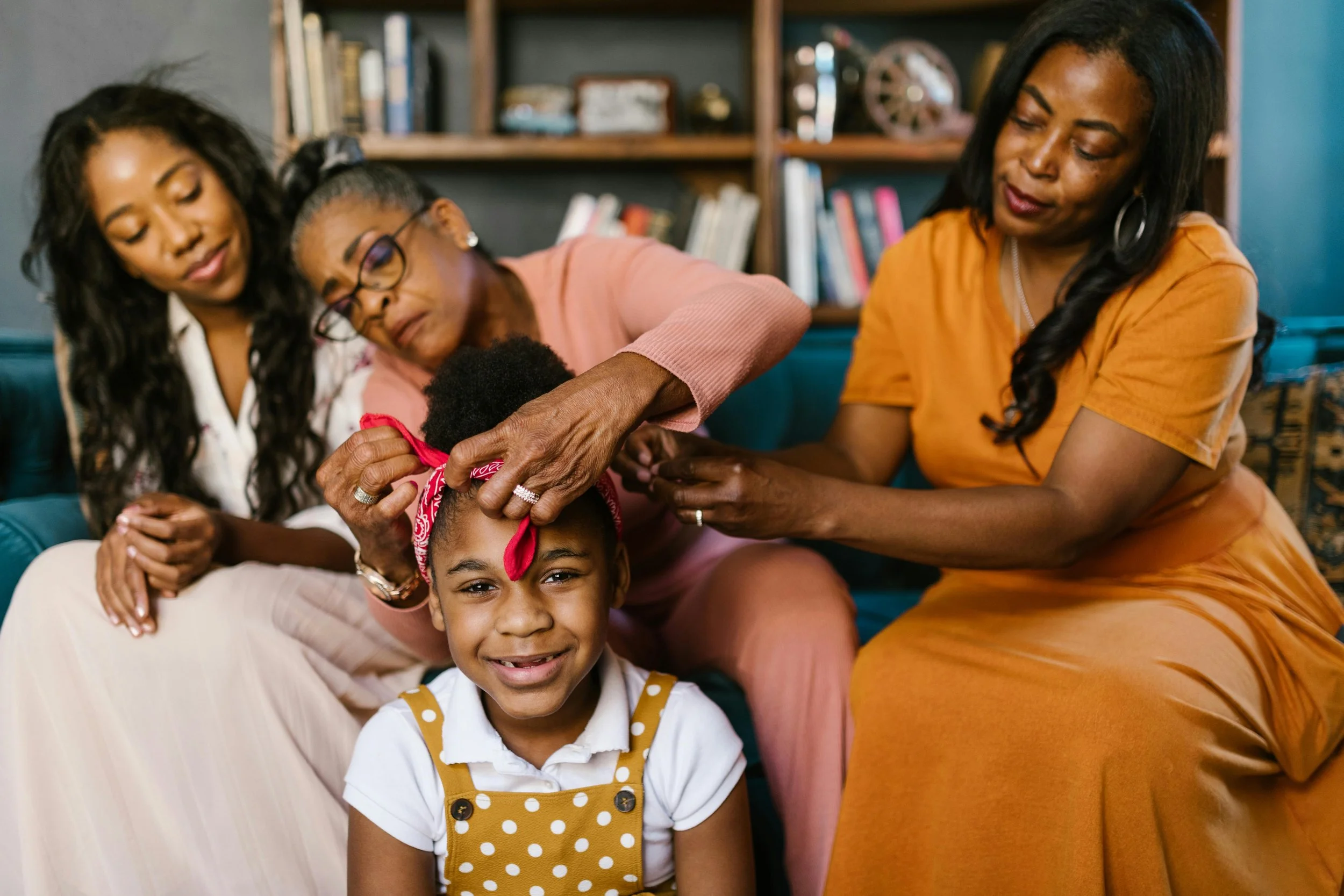 Multiple generations of women and a young girl together, representing the family mediation services available in Florida at Collected Connections