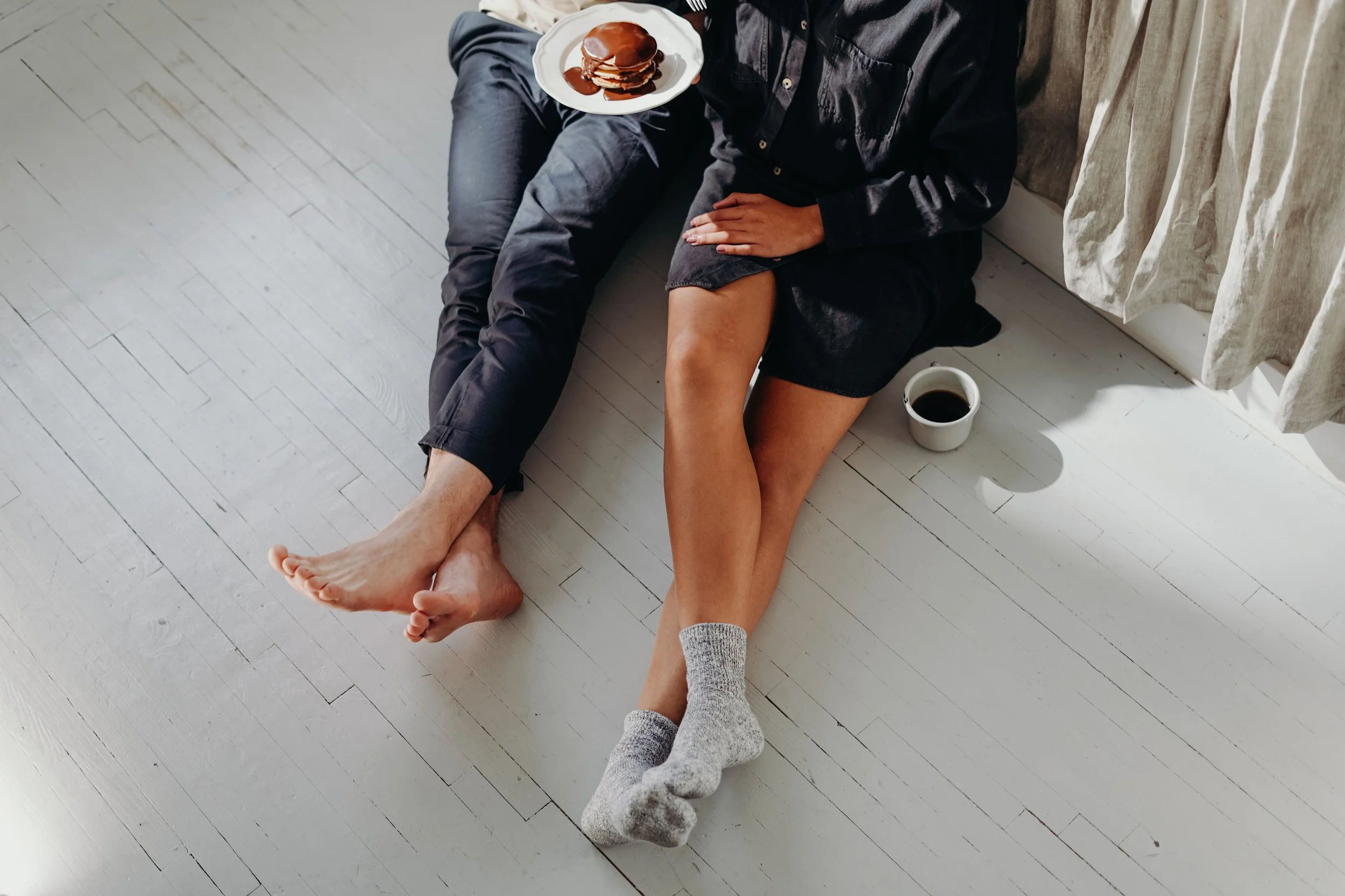 A couple sitting together in a calm, present moment, representing the connection that becomes possible when couples in Florida address the Four Horsemen patterns in Gottman Method therapy
