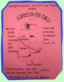 Pink poster advertising a play titled 'Soreux-De-Dieu,' featuring a licorice stick with whipped cream and a spider.