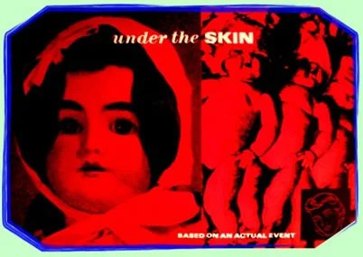 Poster with a woman's face on the left and a crowd of people on the right, with the words "under the SKIN" at the top.