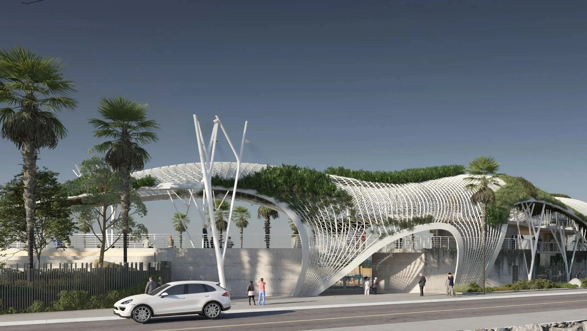 Modern architectural structure with white, curved, open-worked design, greenery on top, surrounded by palm trees and people walking nearby, with cars on the street in the foreground.