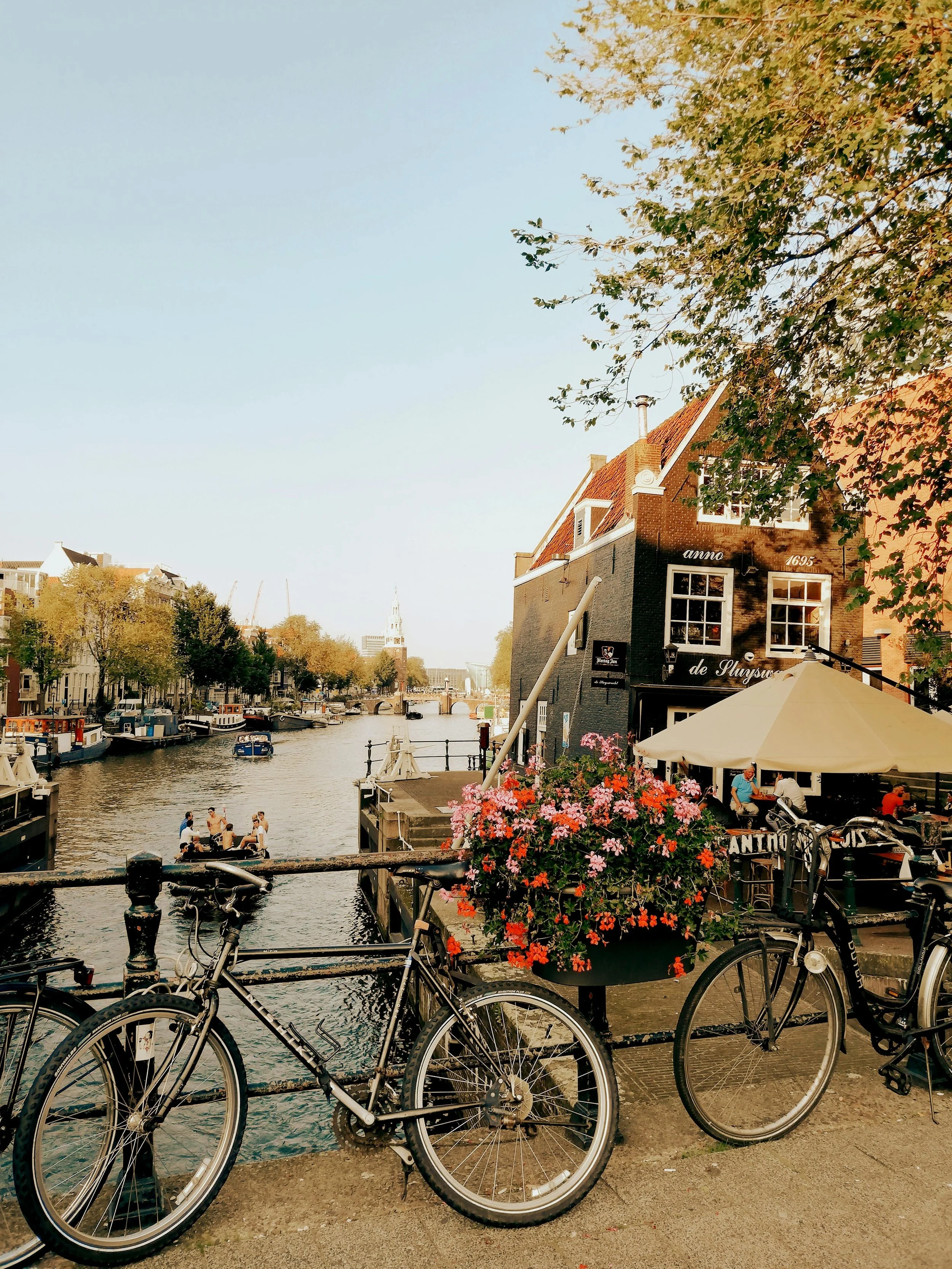 Amsterdam cafe on the canals in the summer with a bike in the picture