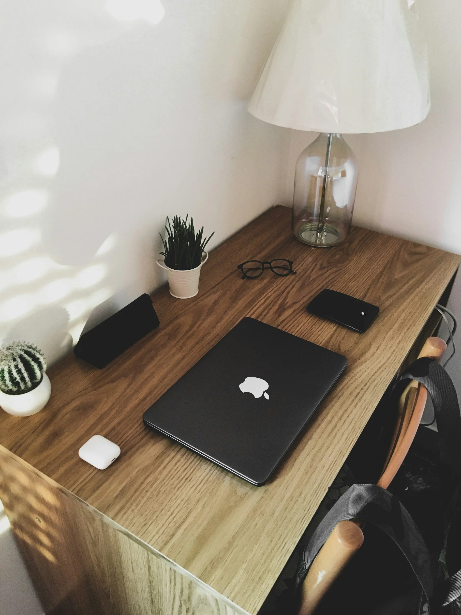 Organized wooden desk with a MacBook, representing professional clinical supervision and EMDR consultation for Ohio therapists.