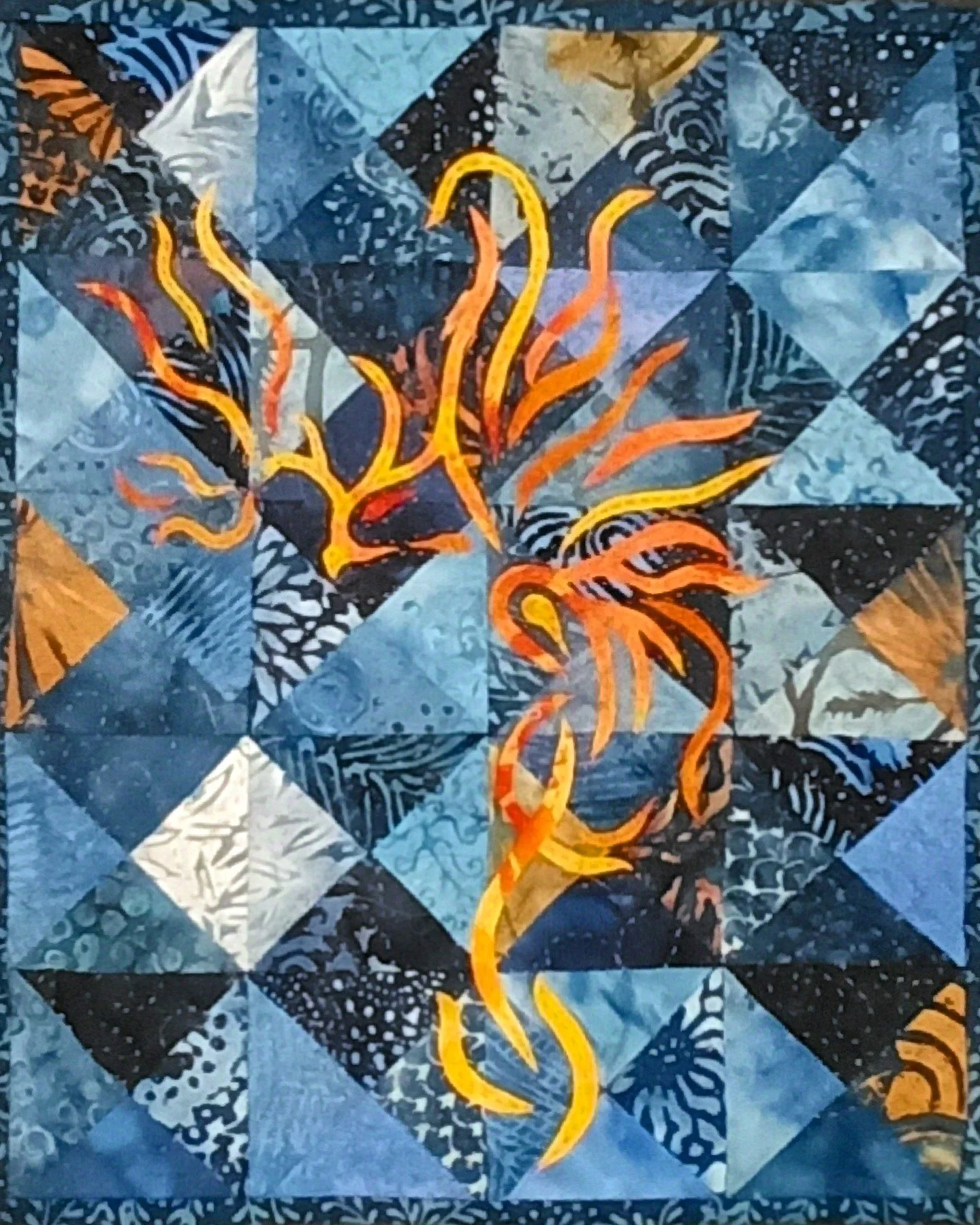 "Little Phoenix&copy;" pattern appliqued on a bias square background. This miniature is only 11.5 x 9 inches!