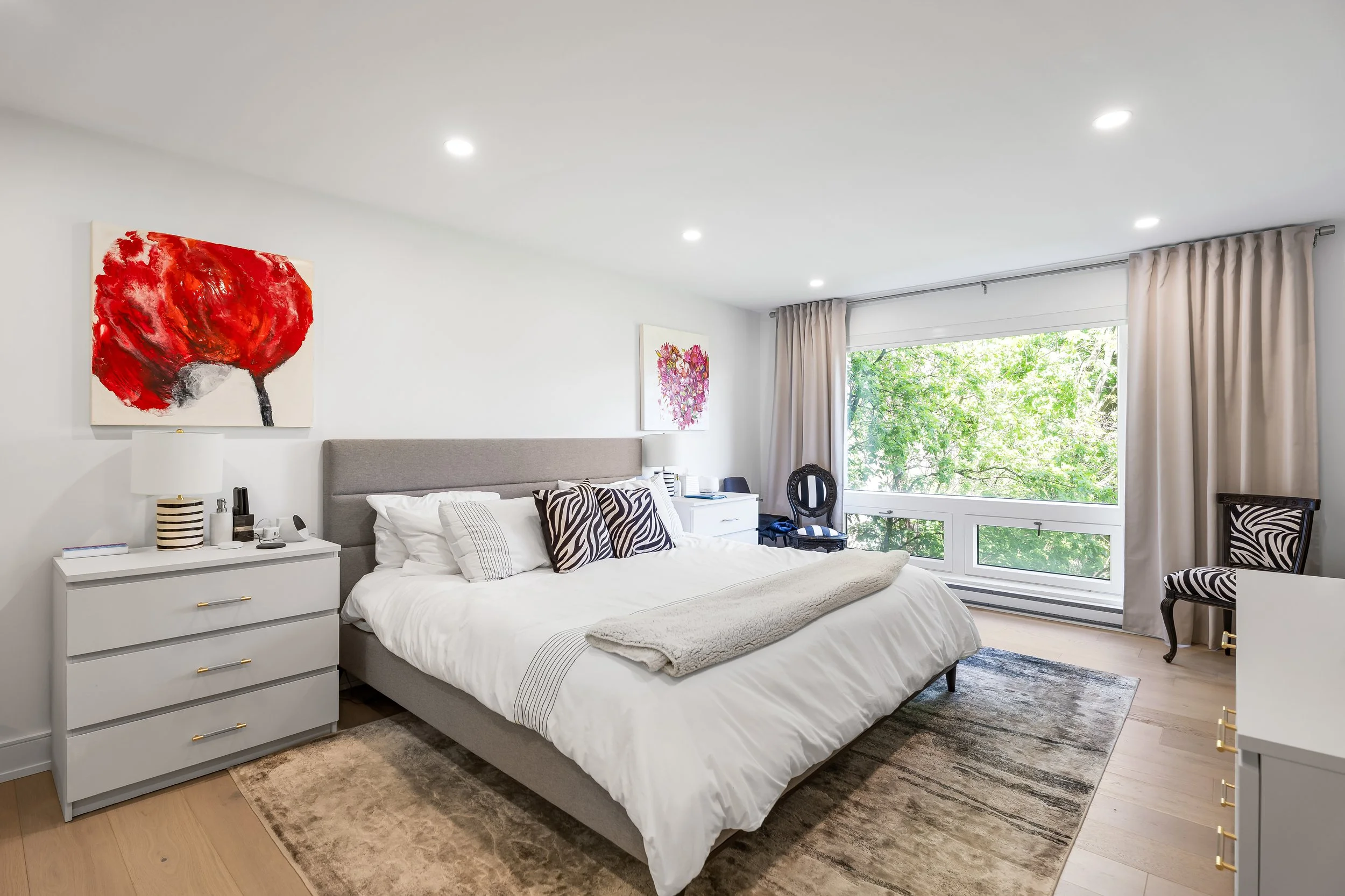 Complete overhaul of Montreal condo in this high-end renovation featuring new floors, custom curtains, recessed lighting. 