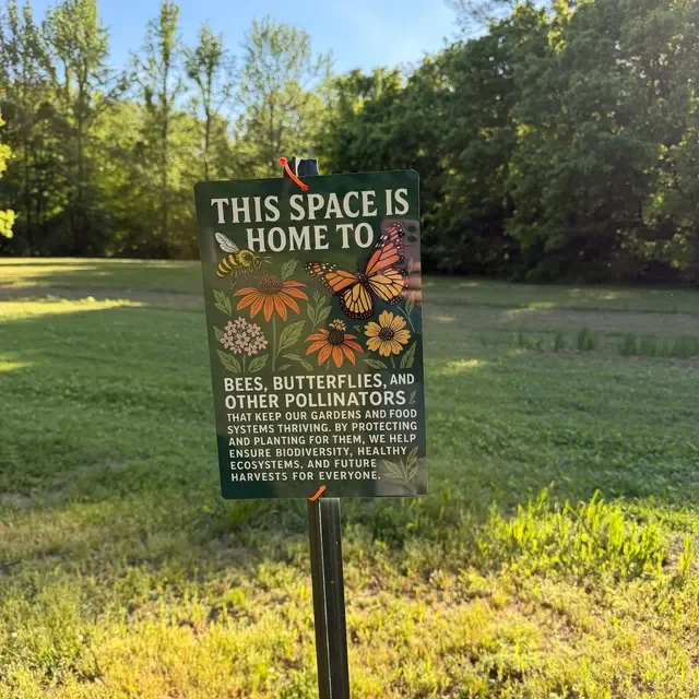 A customer image of their installed Pollinator Habitat sign.