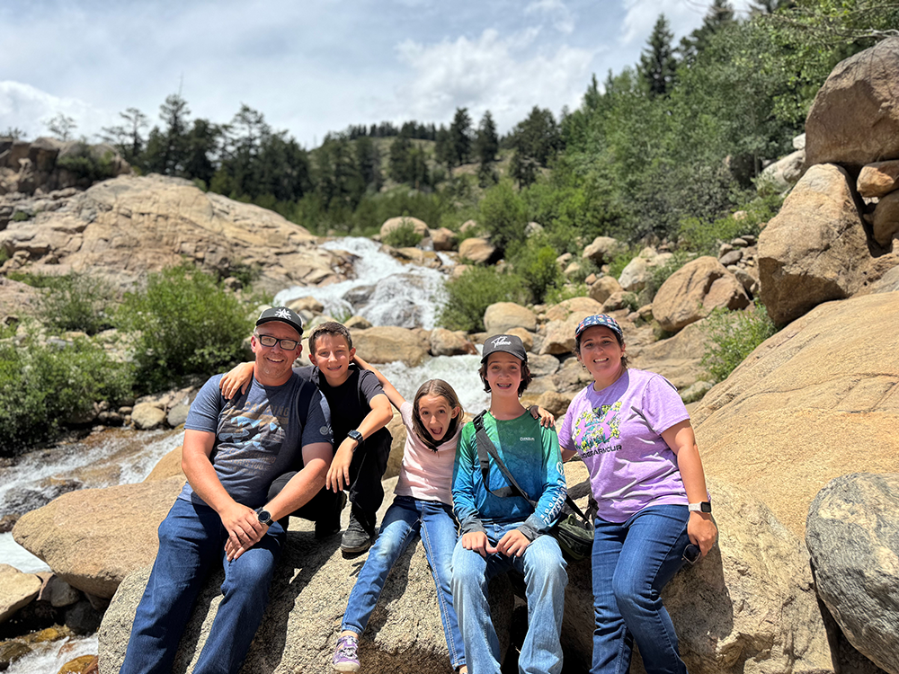 Stanley family in front of washout area