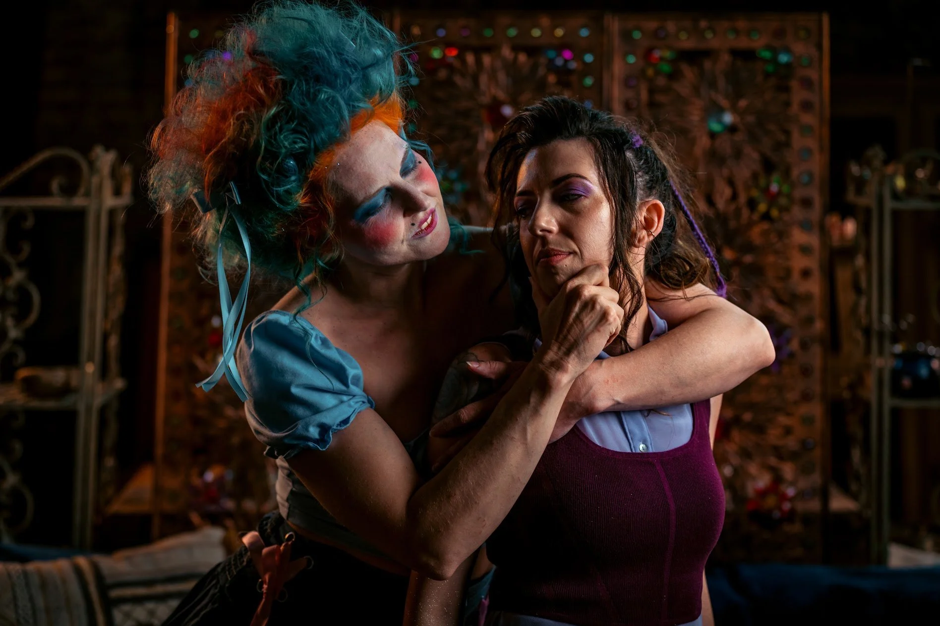 Two models portraying alternative takes on Hades and Megara from Hercules