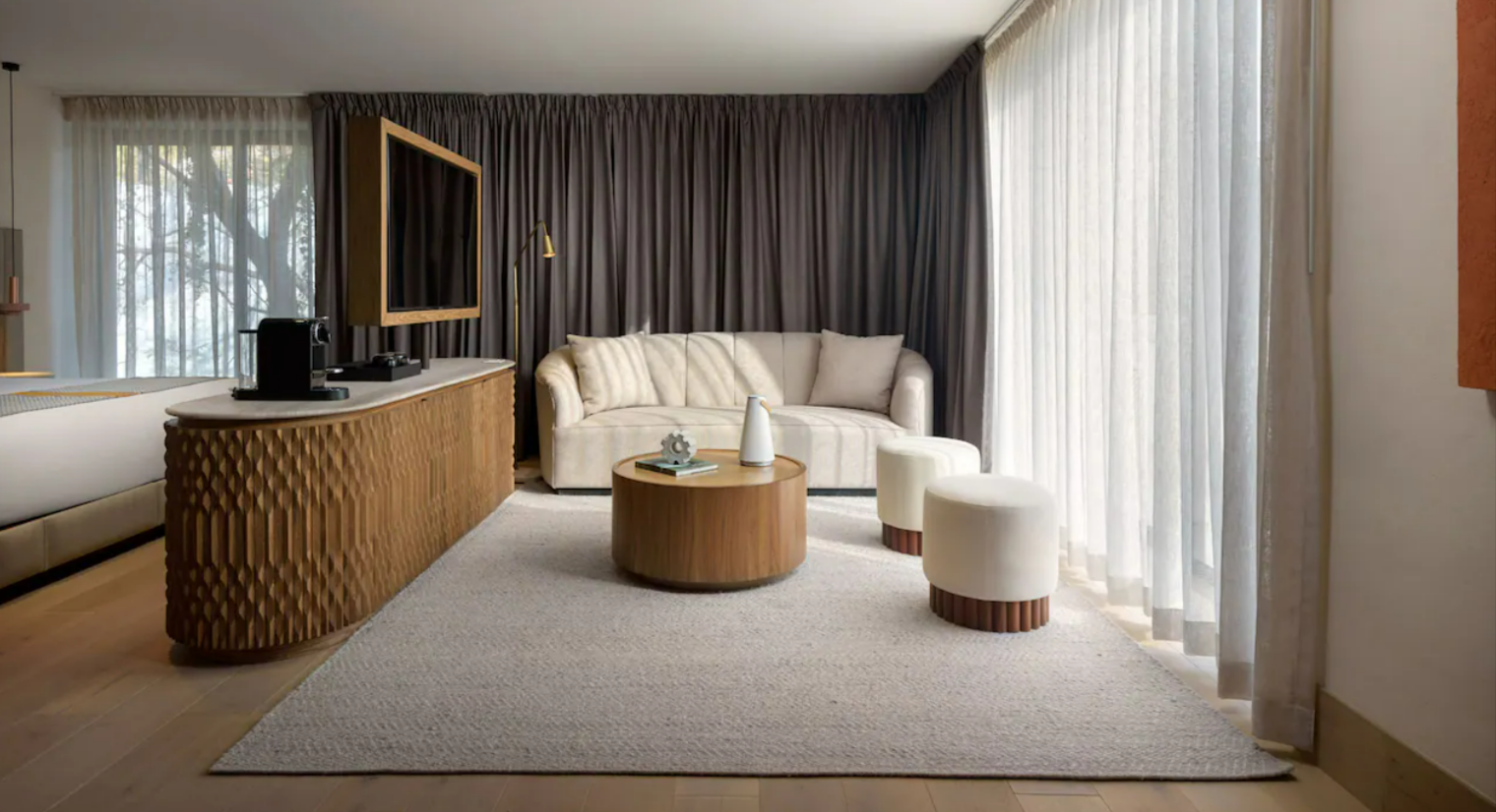 hotel room with sofa table tv for stem cell therapy in san miguel de allende mexico