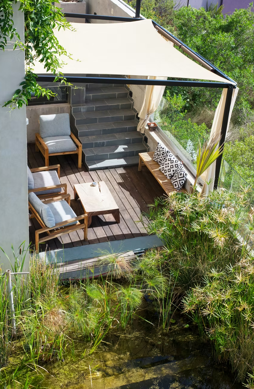 Aerial view of a patio surrounded by lush greenery at the hotel Cuna de Cielo in San Miguel de Allende