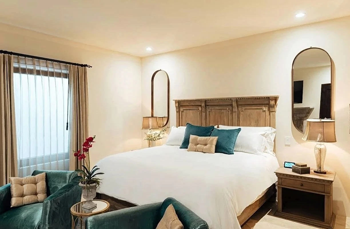 room with bed sofa chairs and window in Hotel El Golpe de Vista San Miguel de Allende Mexico where we do stem cell therapy.