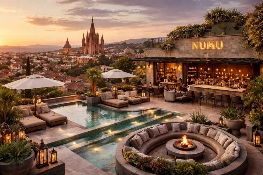 Luxury rooftop at NUMU Hotel in San Miguel de Allende, a partner hotel of Stems for Life, featuring an infinity pool, elegant lounge areas, and panoramic sunset views for premium regenerative medicine stays.