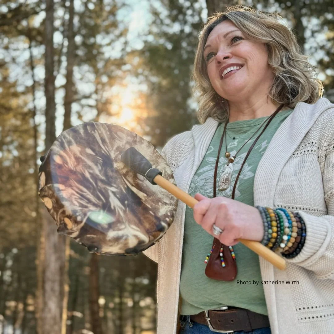 Heidi Doser, shamanic practitioner, drumming in the forest