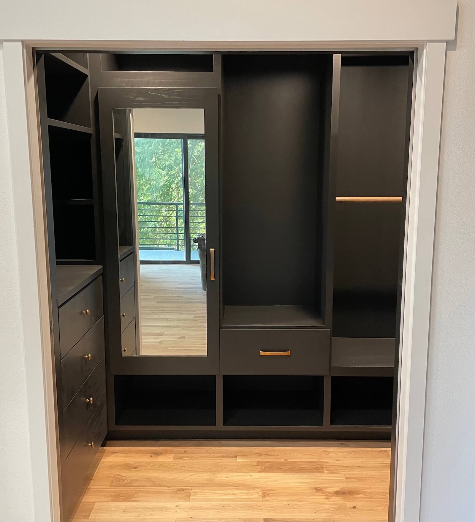 Built in closet storage solution, with racks, drawers, jewelry storage, hanging storage and shoe storage. Built-in dressers